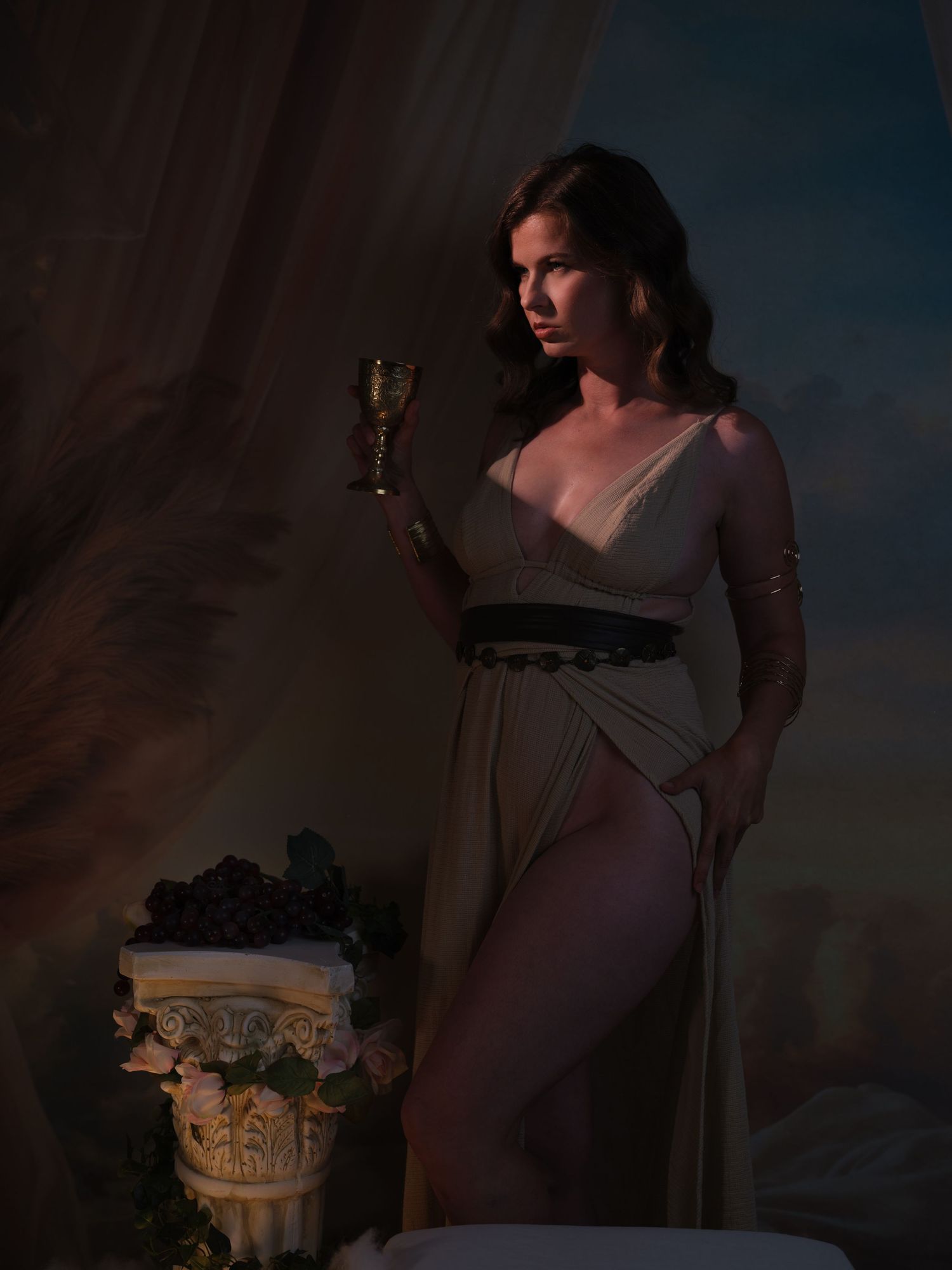 Moody boudoir portraits in vintage setting with classical architectural elements.