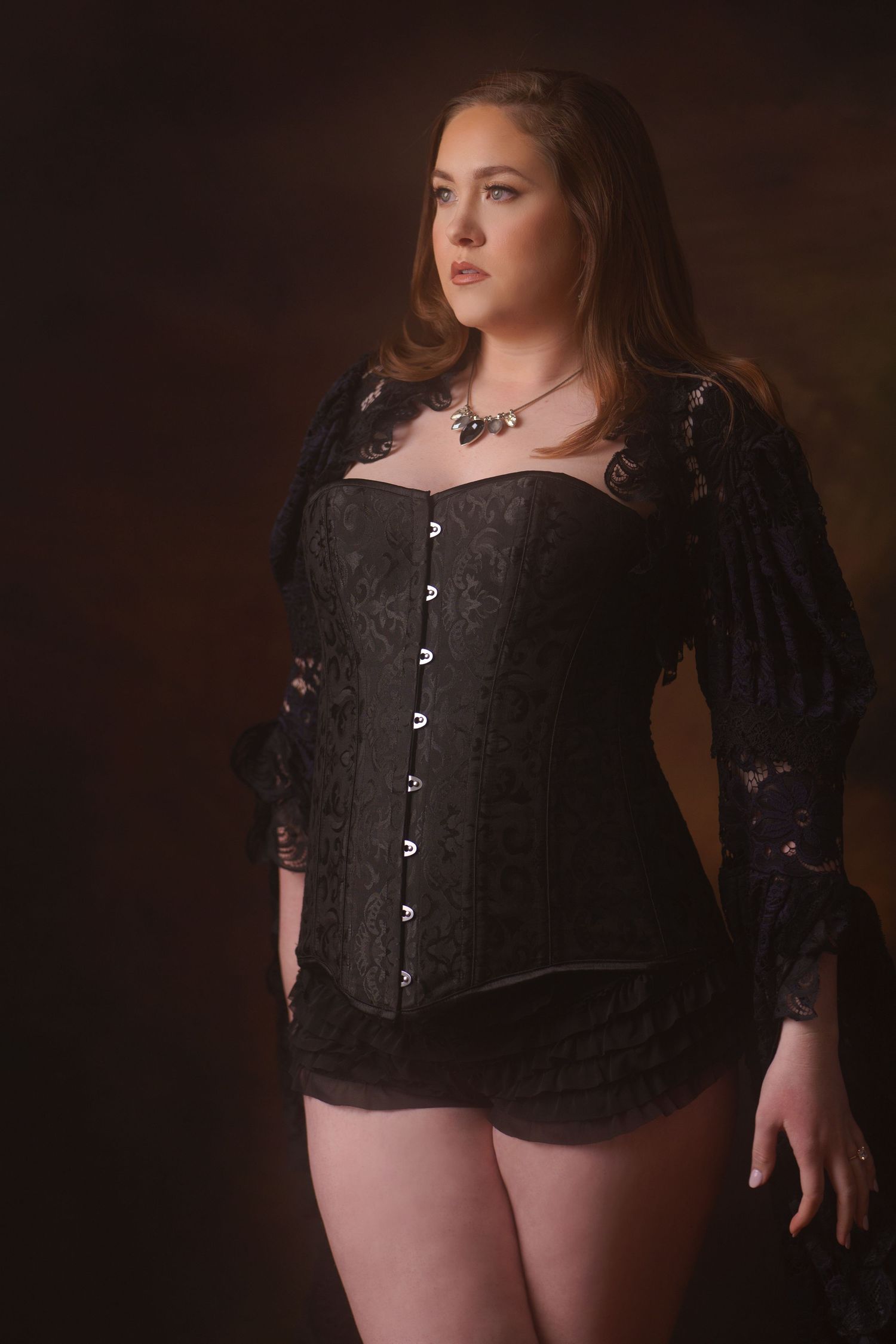 Vintage-style portrait in black velvet corset with button details.
