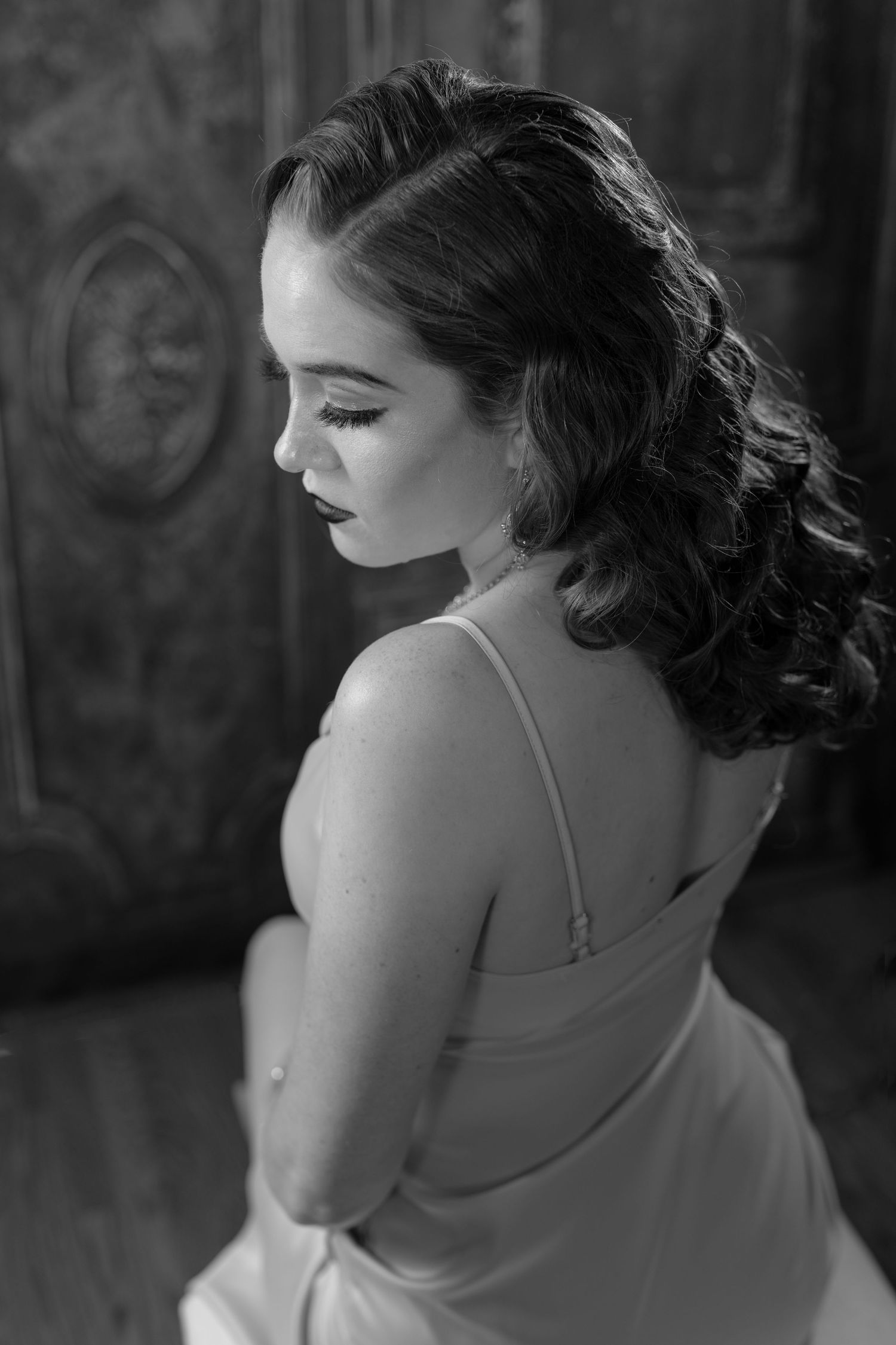 Vintage inspired black and white portraits with elegant styling and dramatic side lighting.