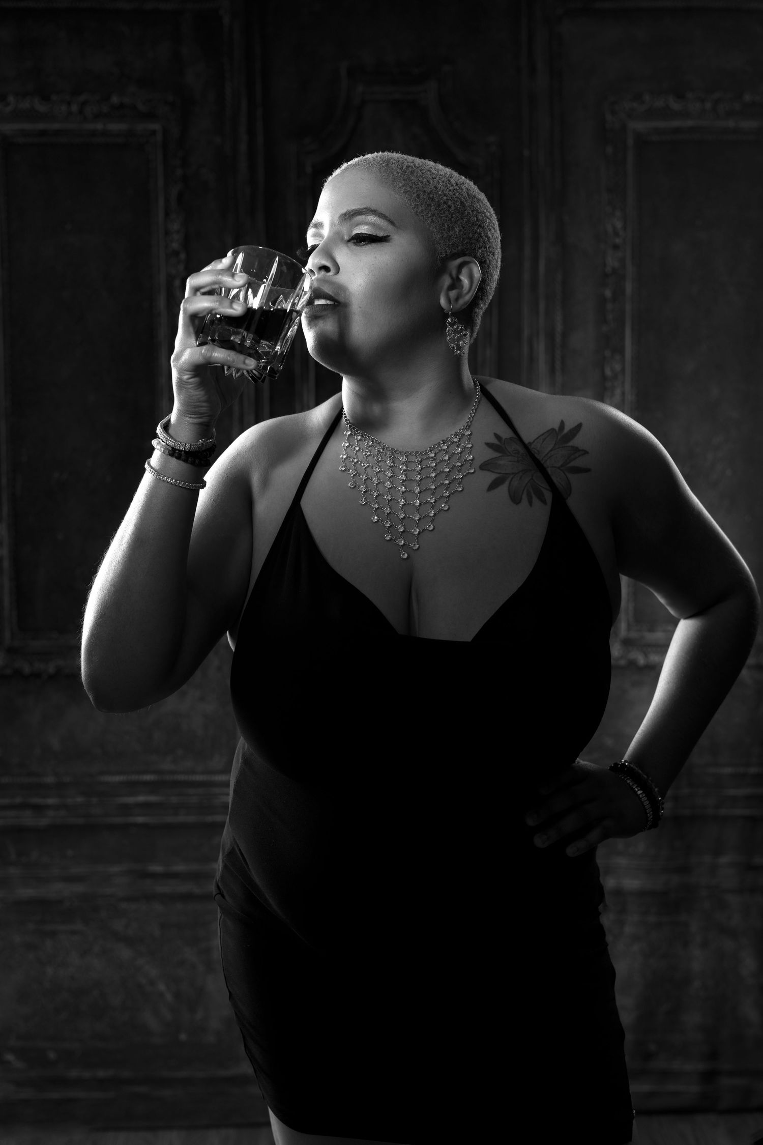 Dramatic black and white portrait series with statement necklace.