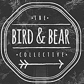 The Bird & Bear Collective logo with vintage badge design on dark chalkboard background.