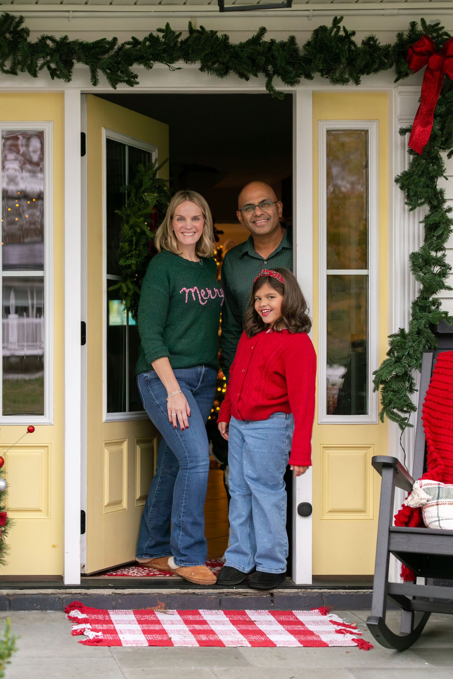 A series of four holiday photos showing people sitting on a front porch decorated with Christmas garland and red bows.