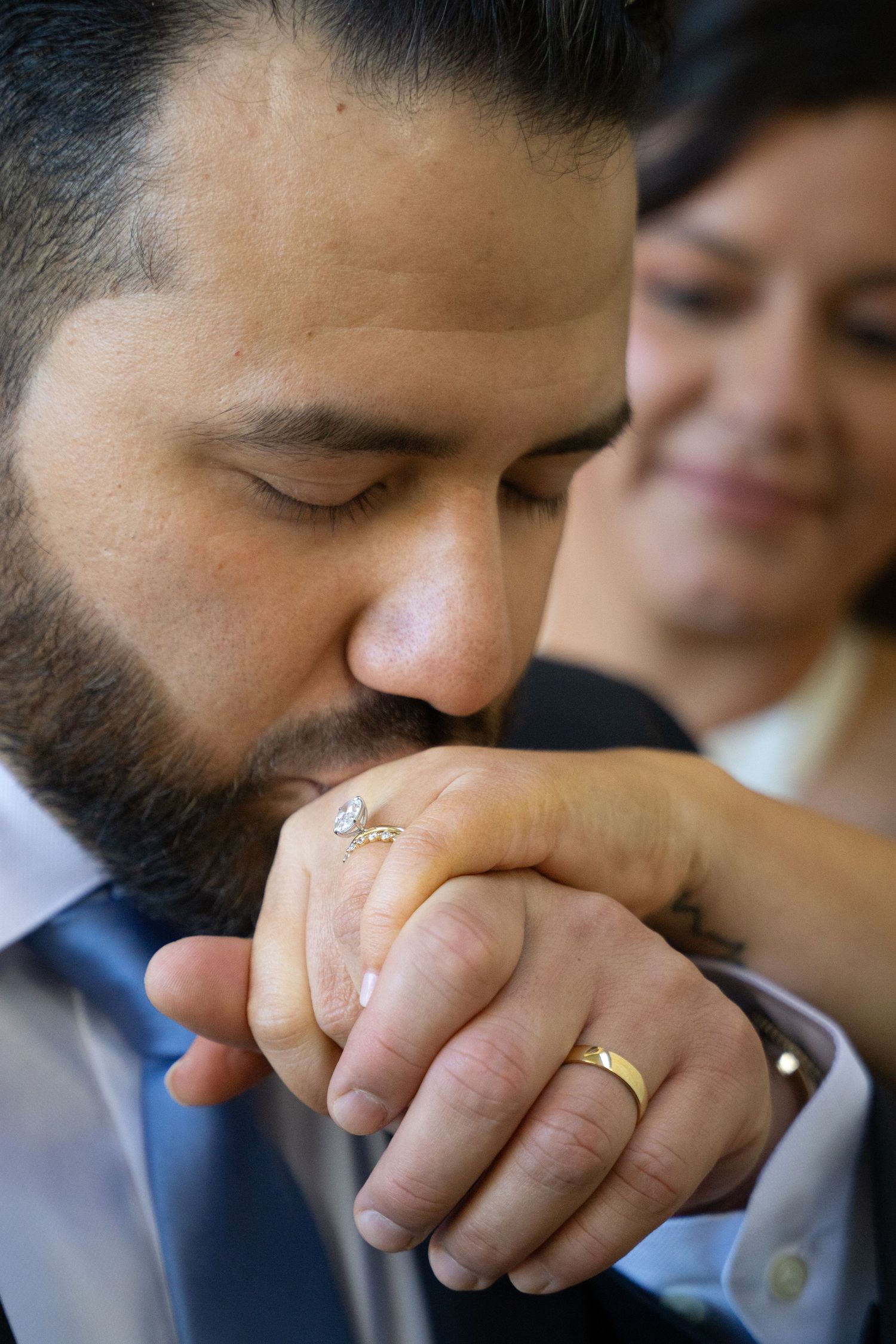 Close-up shots showing a hand wearing a wedding ring in different poses and angles.