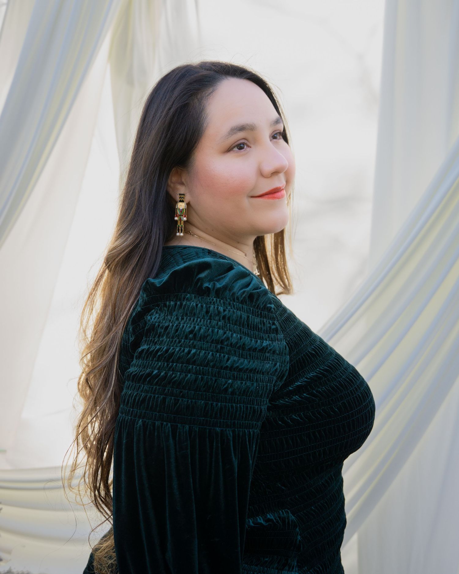 Portrait series of someone in a dark velvet dress against a light background, shown from different angles.
