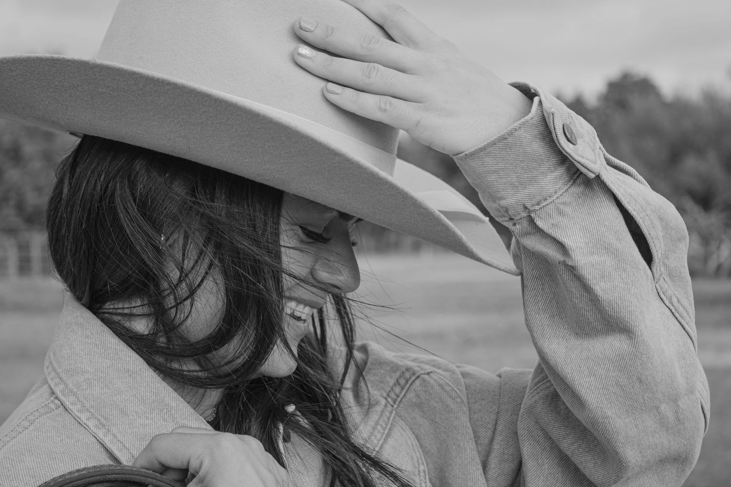 Black and white photo series showing someone lying down with their hand covering their face in different poses.