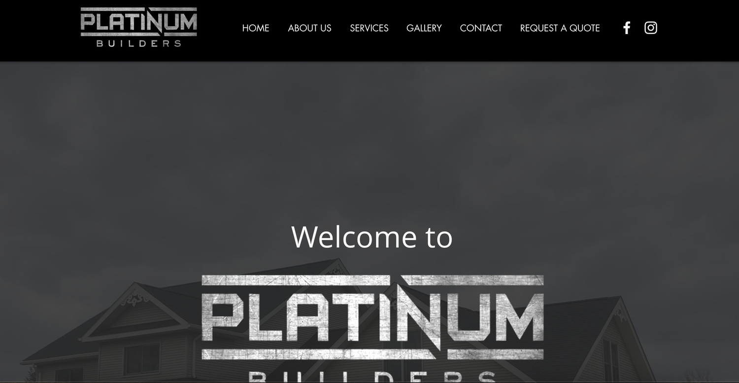 Modern office building exterior with platinum branding and signage illuminated at night.