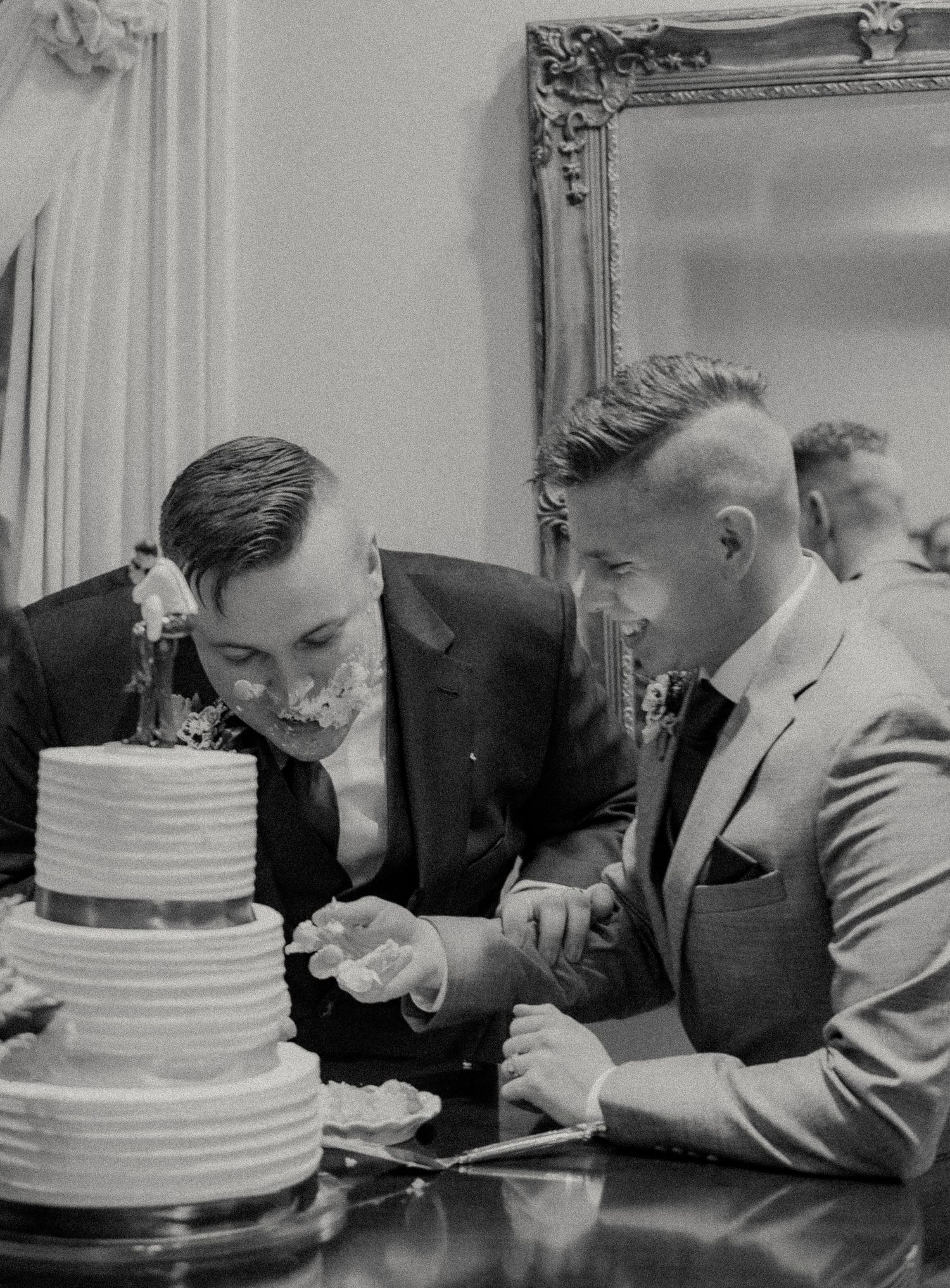 Black and white sequence of wedding cake cutting moments.