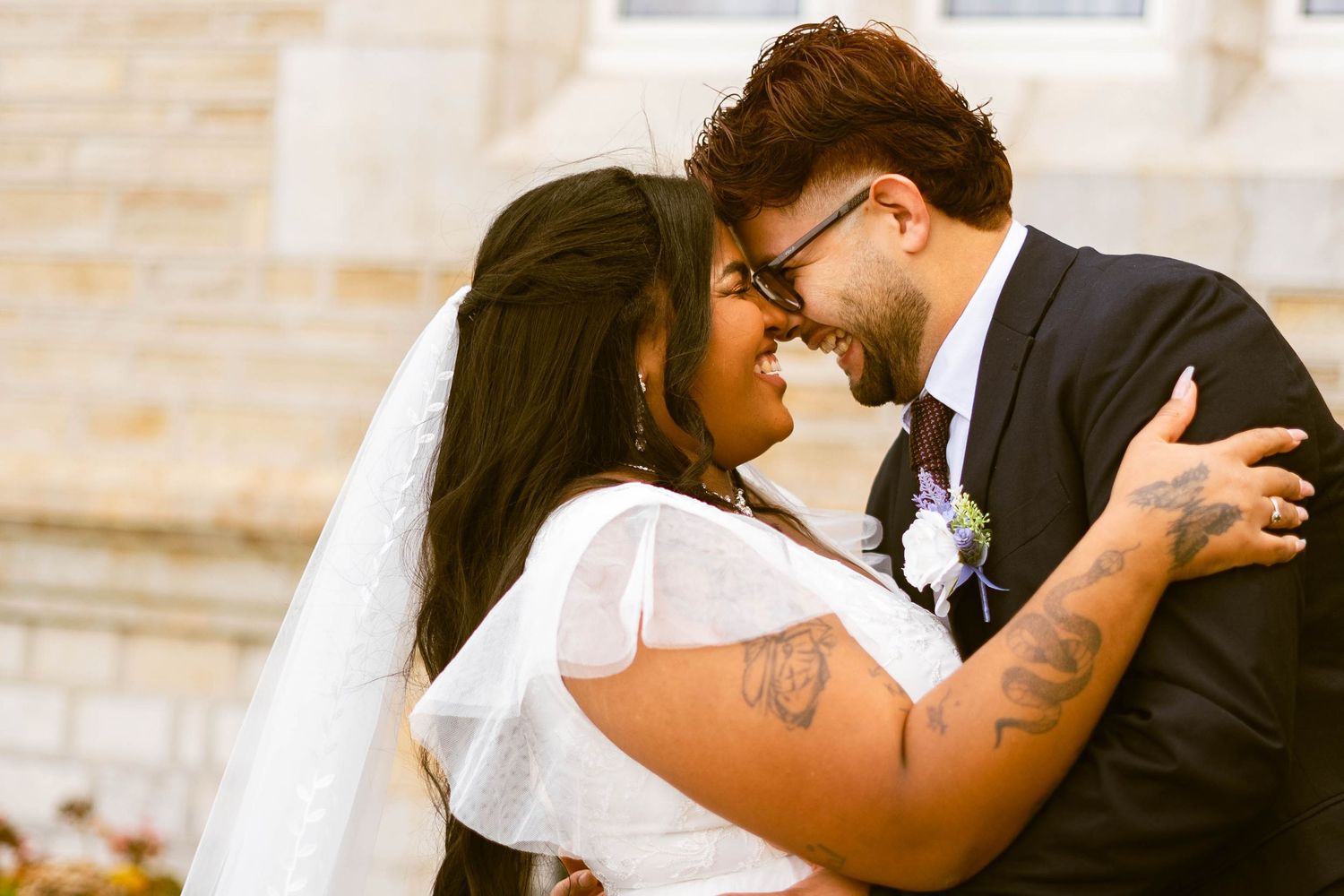 Intimate wedding couple portraits captured in warm sunlight.