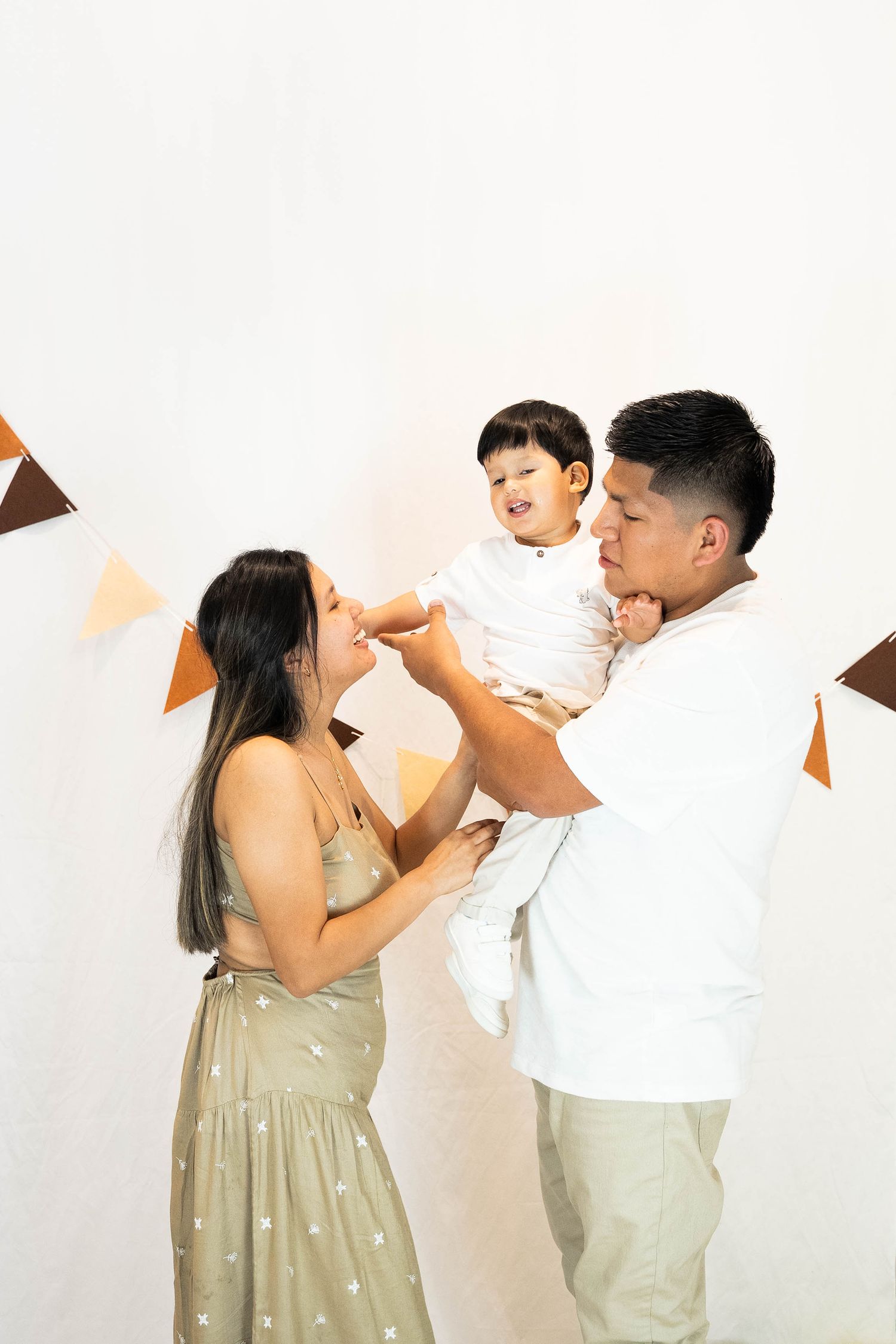 A couple in casual attire playfully share a snack in a series of four connected photos against a white background.