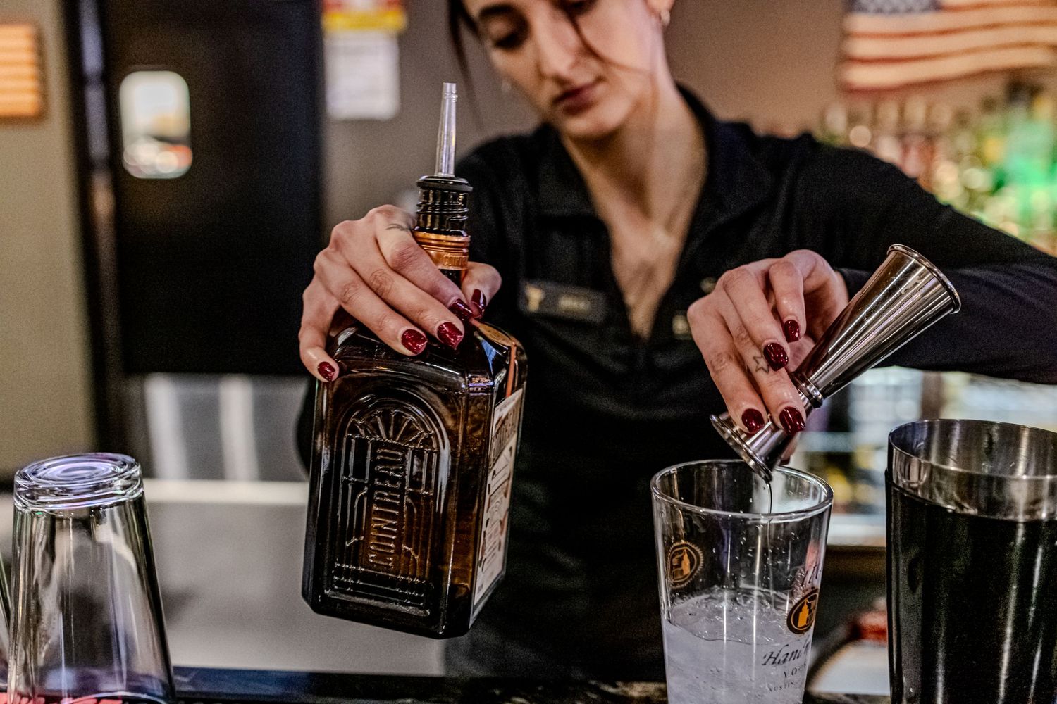 Editorial hospitality photography of a bartender pouring drinks, captured by Katelyn Lucas Photography for restaurant and brand storytelling