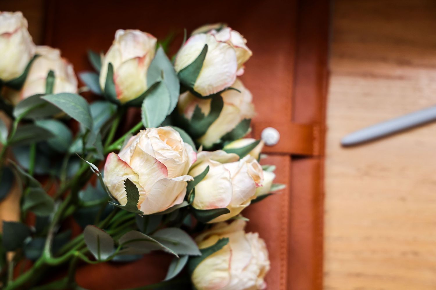 Soft white roses photographed by Katelyn Lucas Photography for romantic visual storytelling and meaningful details.