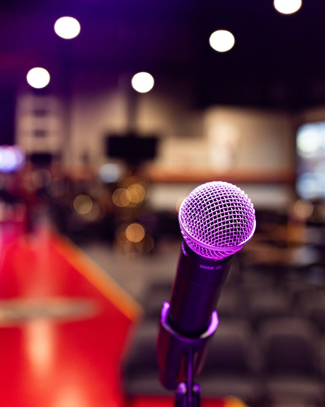 Microphone on stage before a live comedy event, captured for event photography and local experience storytelling by Katelyn Lucas Photograph
