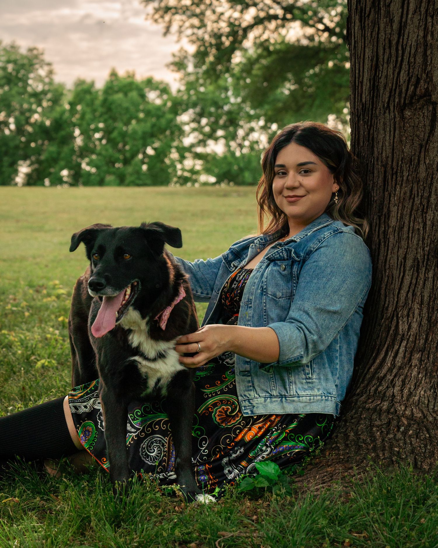 Woman posing with her dog under tree during outdoor photography session at Fort Smith National Historic Site Arkansas