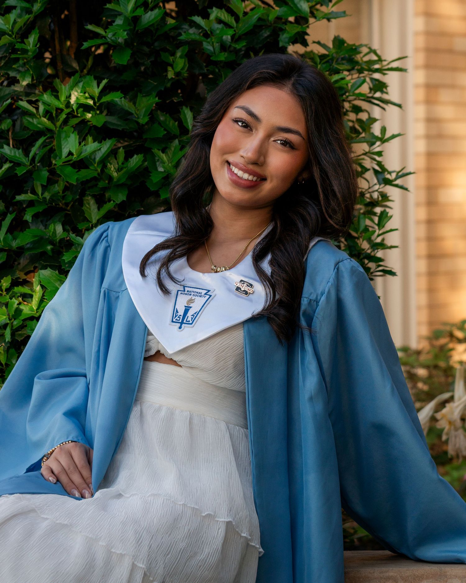 Southside High School senior wearing graduation stole and gown during outdoor portrait session Fort Smith Arkansas