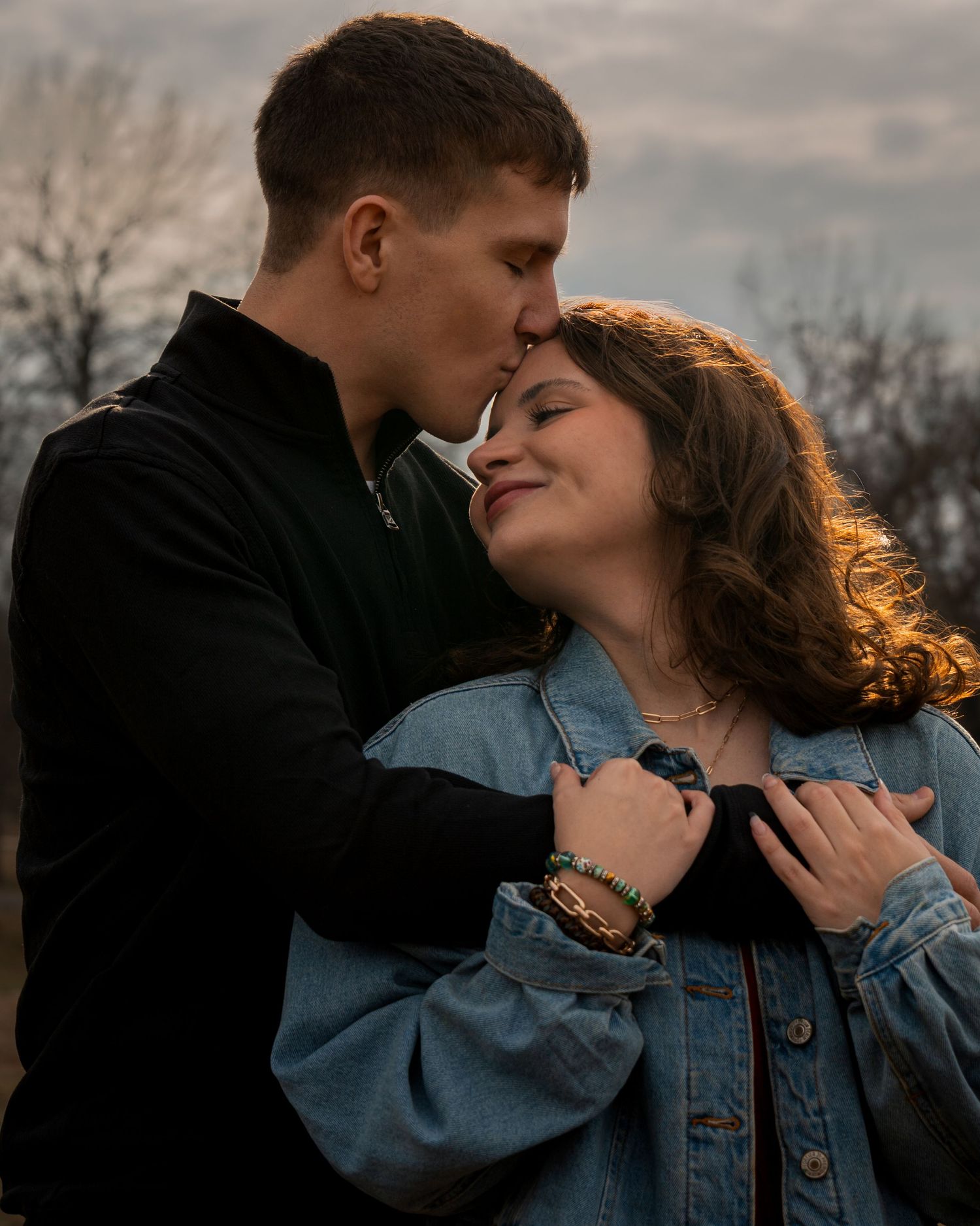 Romantic couple session with forehead kiss during golden hour at Barling City Park Arkansas