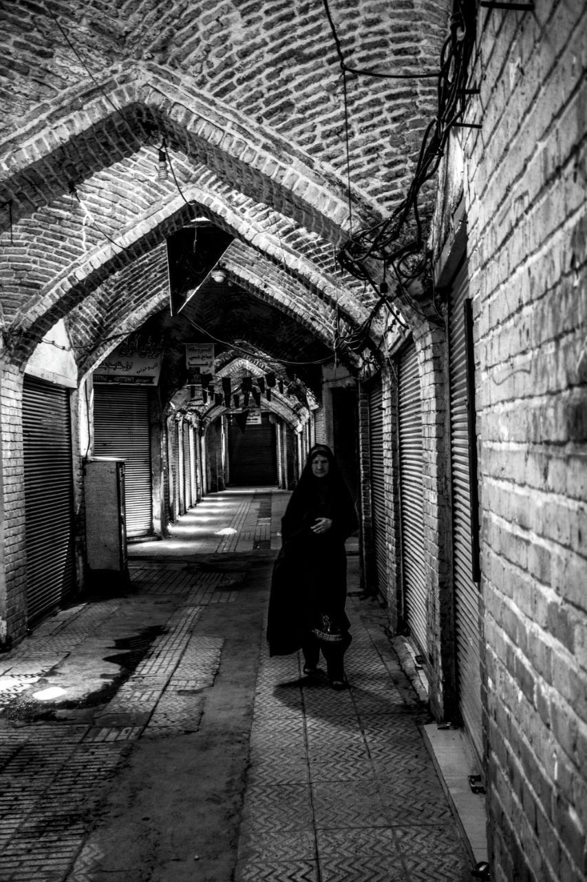 Urban photography showing city life’s energy, candid street moments, and architectural details with natural light.