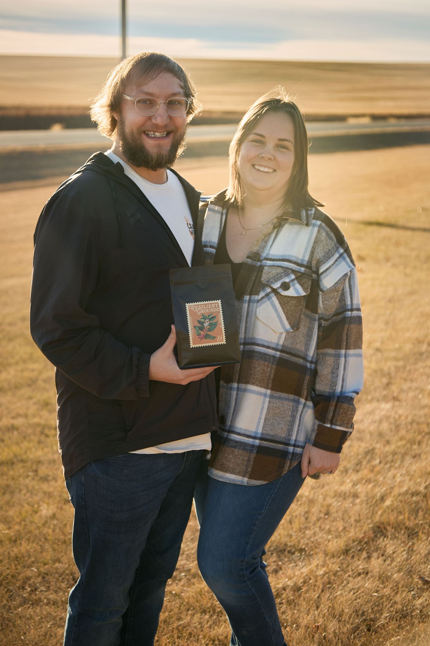 A couple shares joyful moments in a golden wheat field at sunset, captured in a series of candid photographs.
