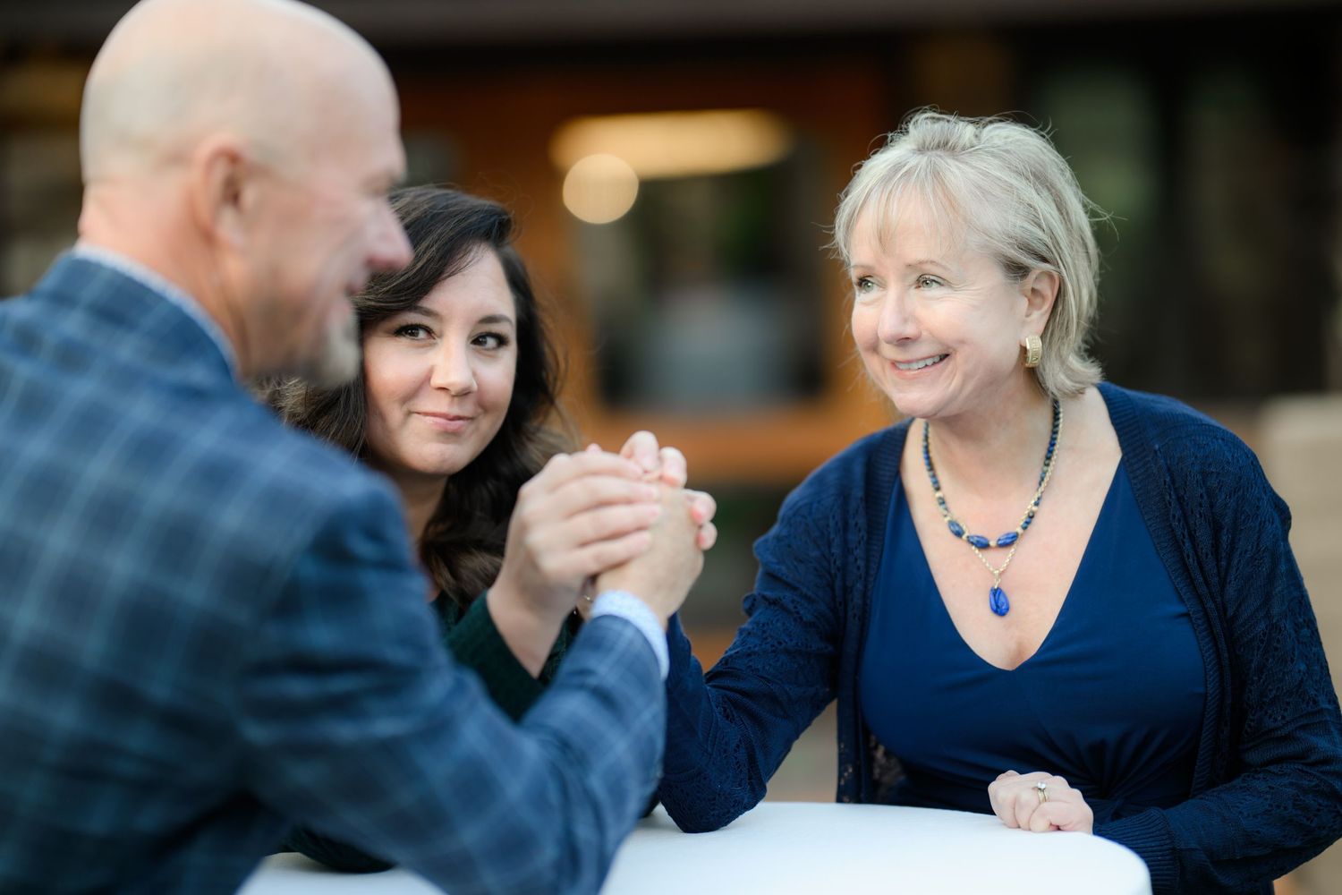 Image of a team building exercise during a business portrait photoshoot for the companies website getting new headshots and branding images