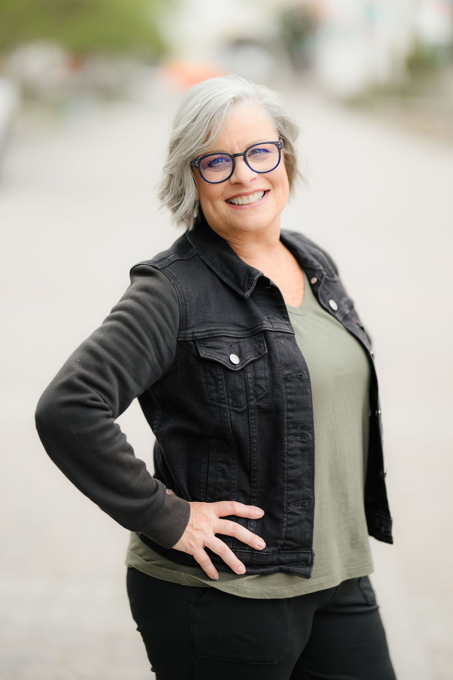 Dawn posing at San Diego state university in a black denim jacket for the second outdoor portion of her personal branding photoshoot.