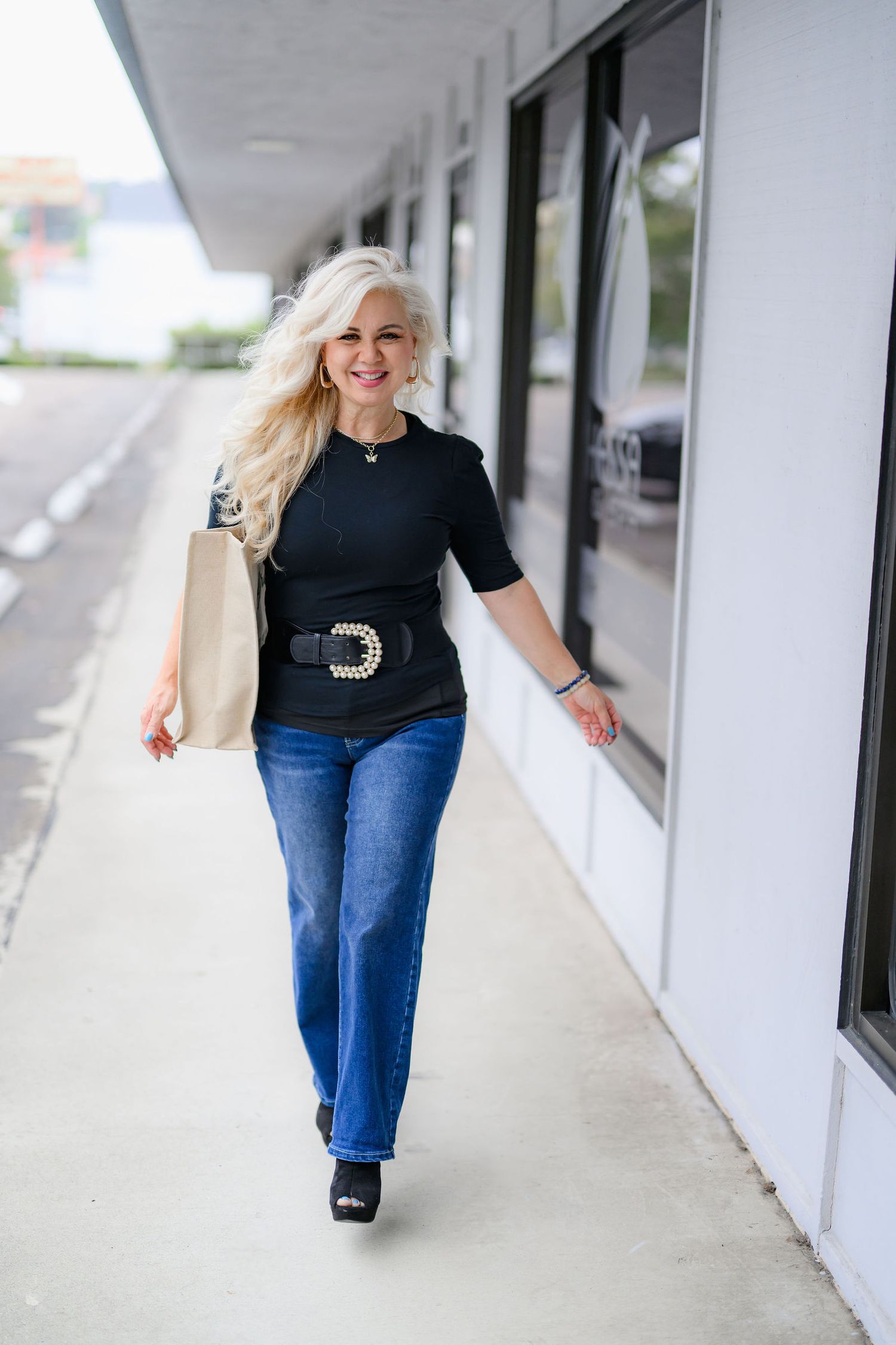Lisa taking a stroll outside her hair salon as part of her personal branding and headshot photoshoot to promote her business.