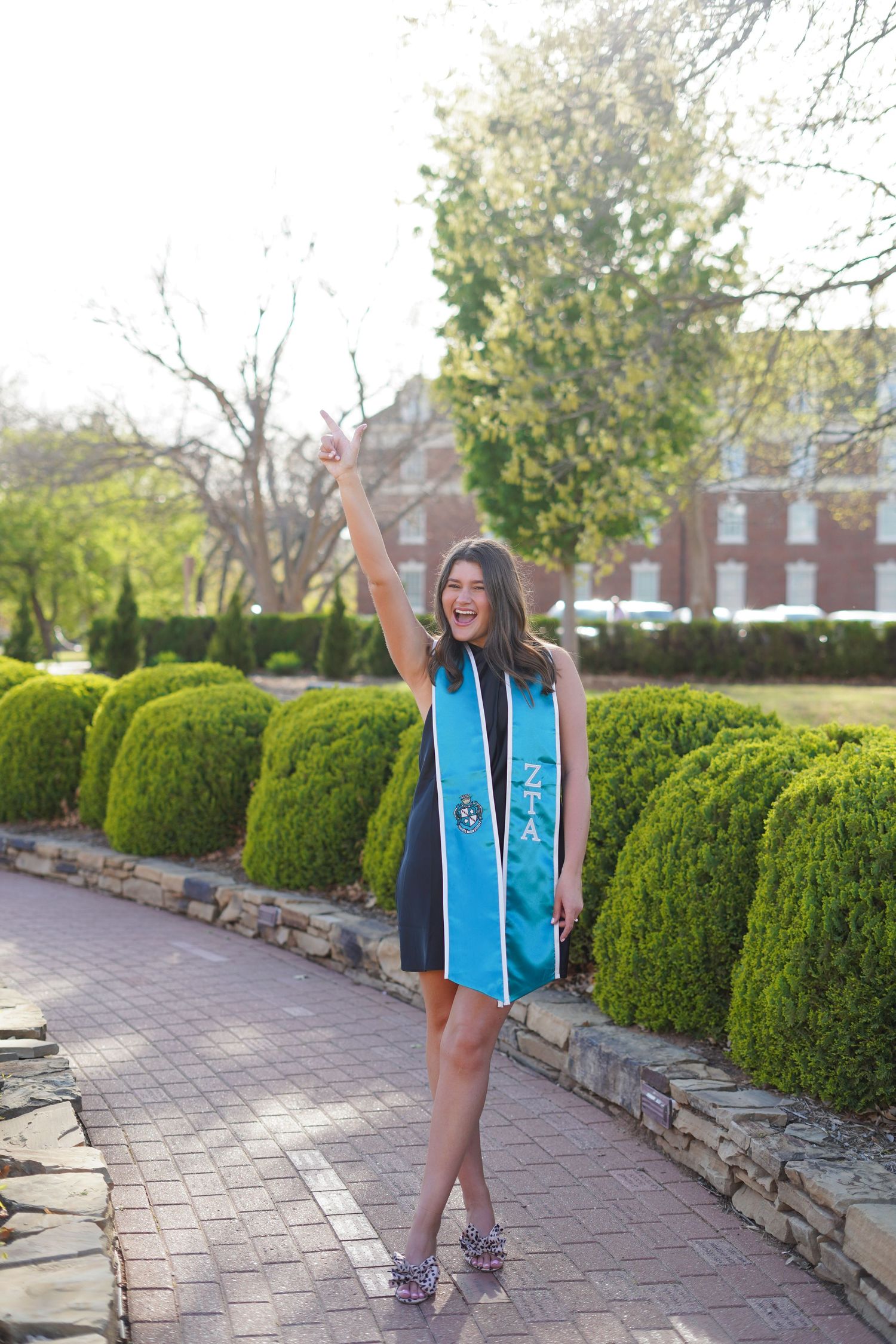 OU and OSU graduation photographer capturing campus and lifestyle portraits in Norman and Stillwater. True-to-color, vibrant images.