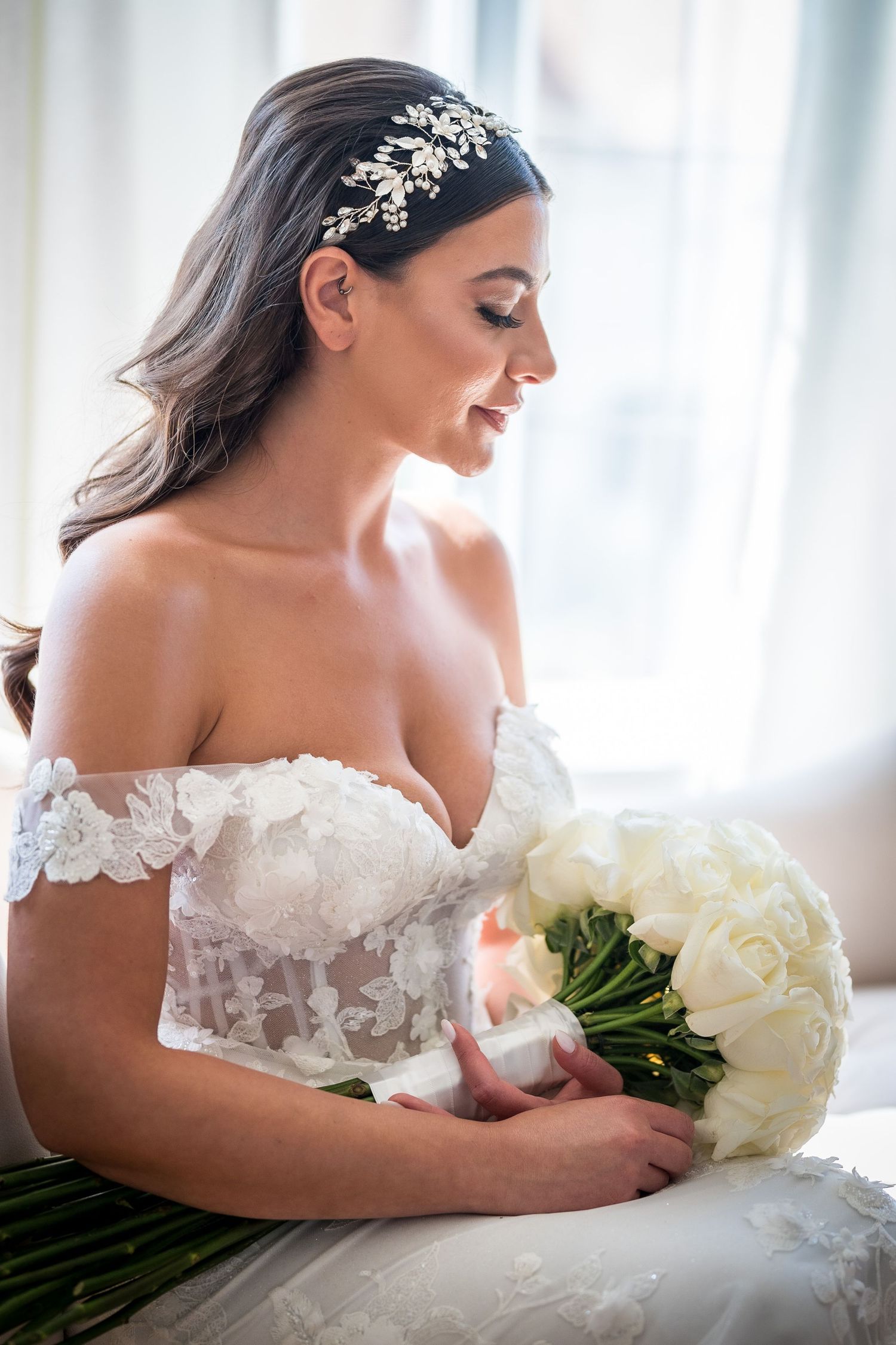 Bride looking at her bouquet