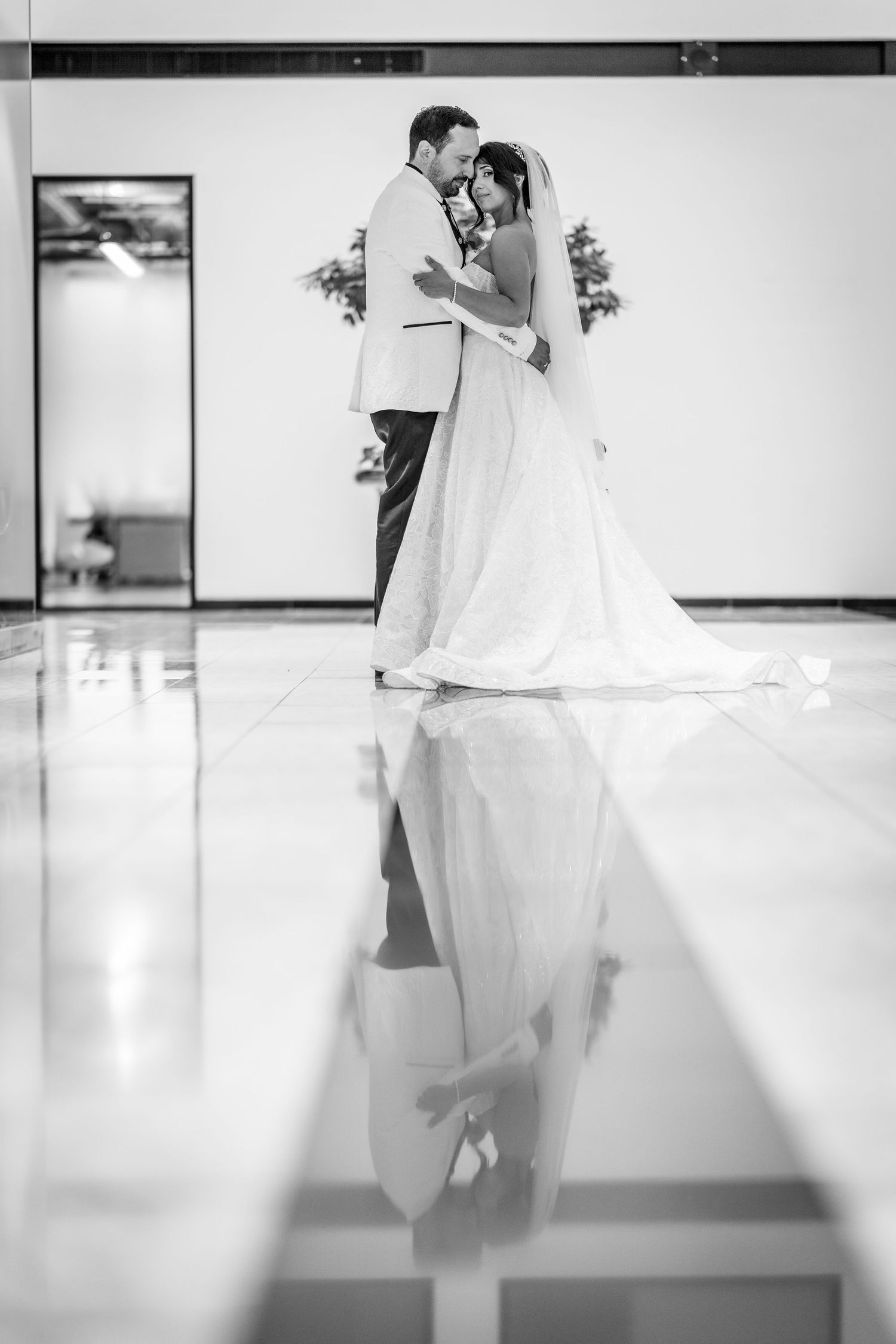 Bride and groom standing in the World Trade Centre in Montreal