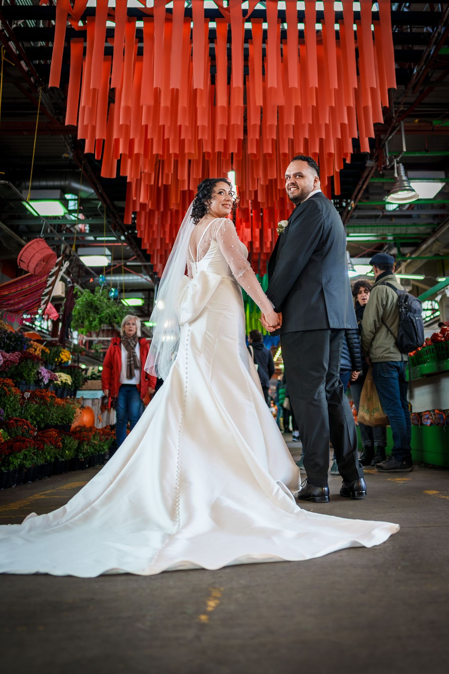 Married couple walking through a market
