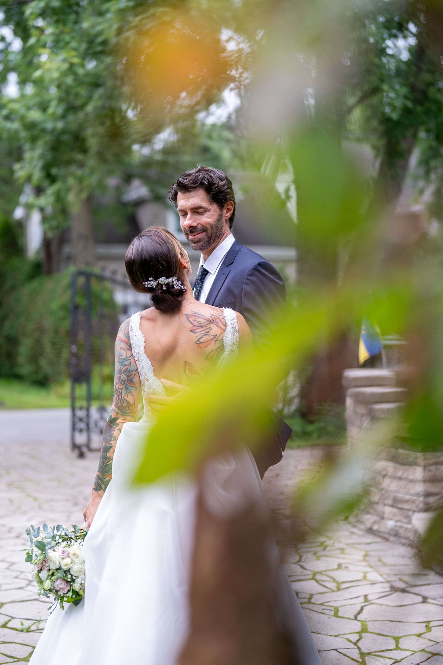 Married couple in front of Chapel Charm in Laval, Quebec