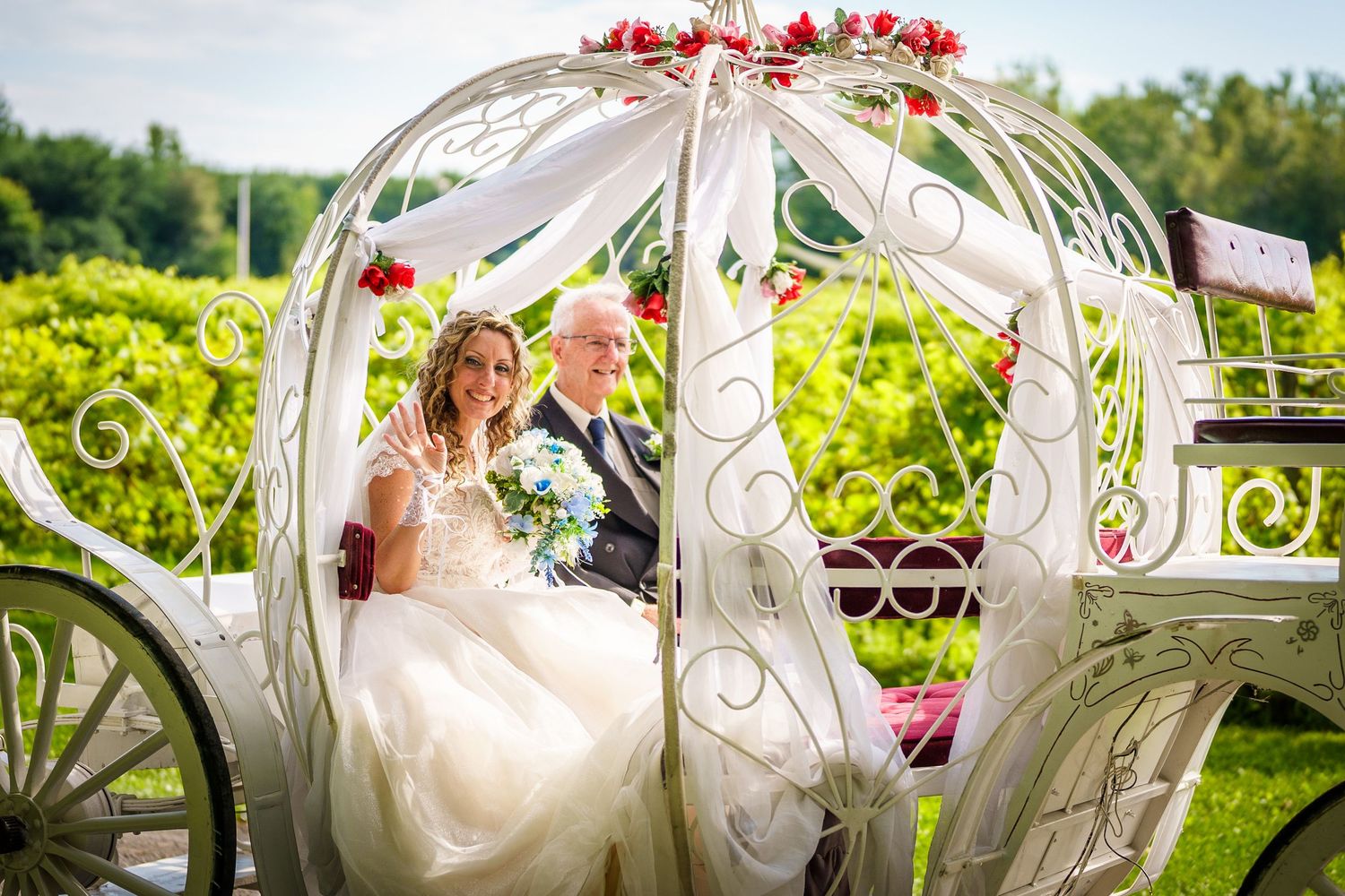 Father rides with her daughter to her wedding ceremony in a horse-drawn carriage