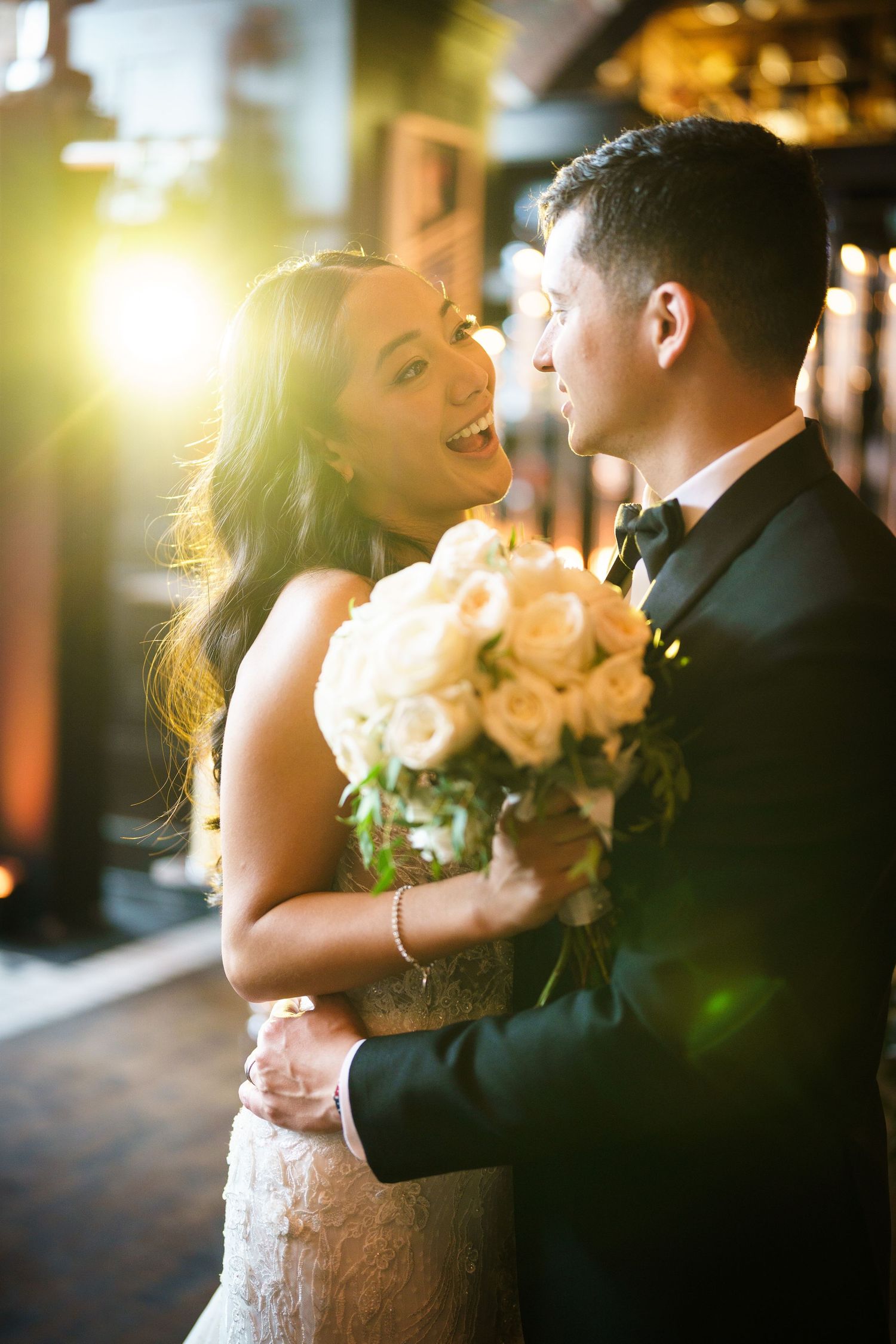 Married couple enjoying a moment during their wedding reception at 40 West restaurant in Montreal