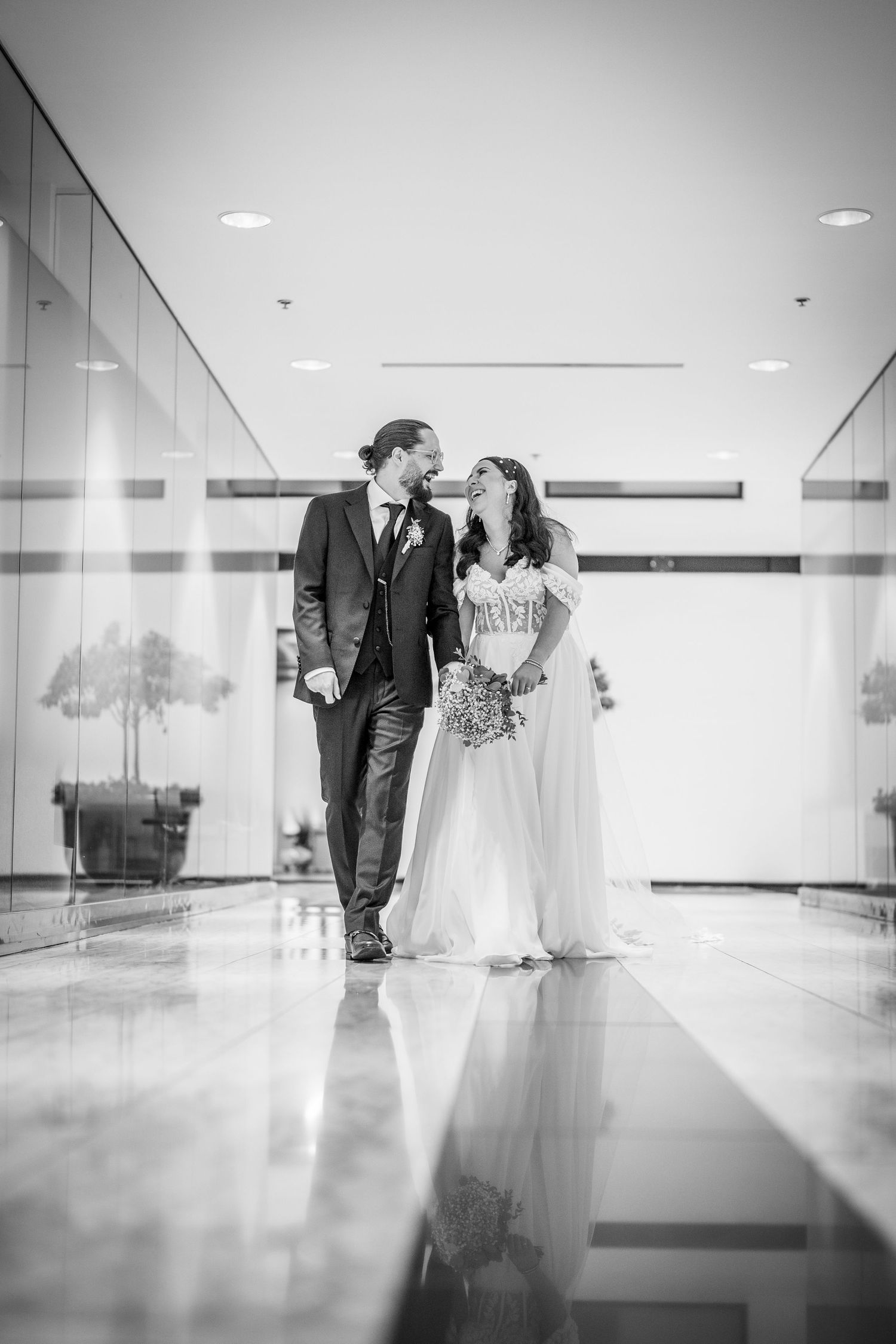 Bride and groom walking in the World Trade Centre in Montreal