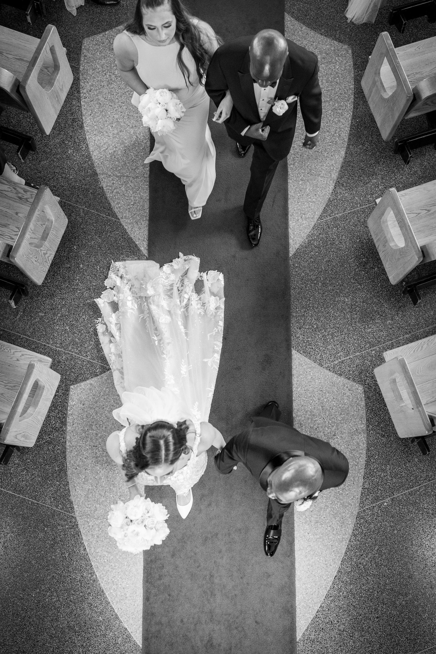 Bride and groom walk down the aisle leaving a Montreal, Quebec church