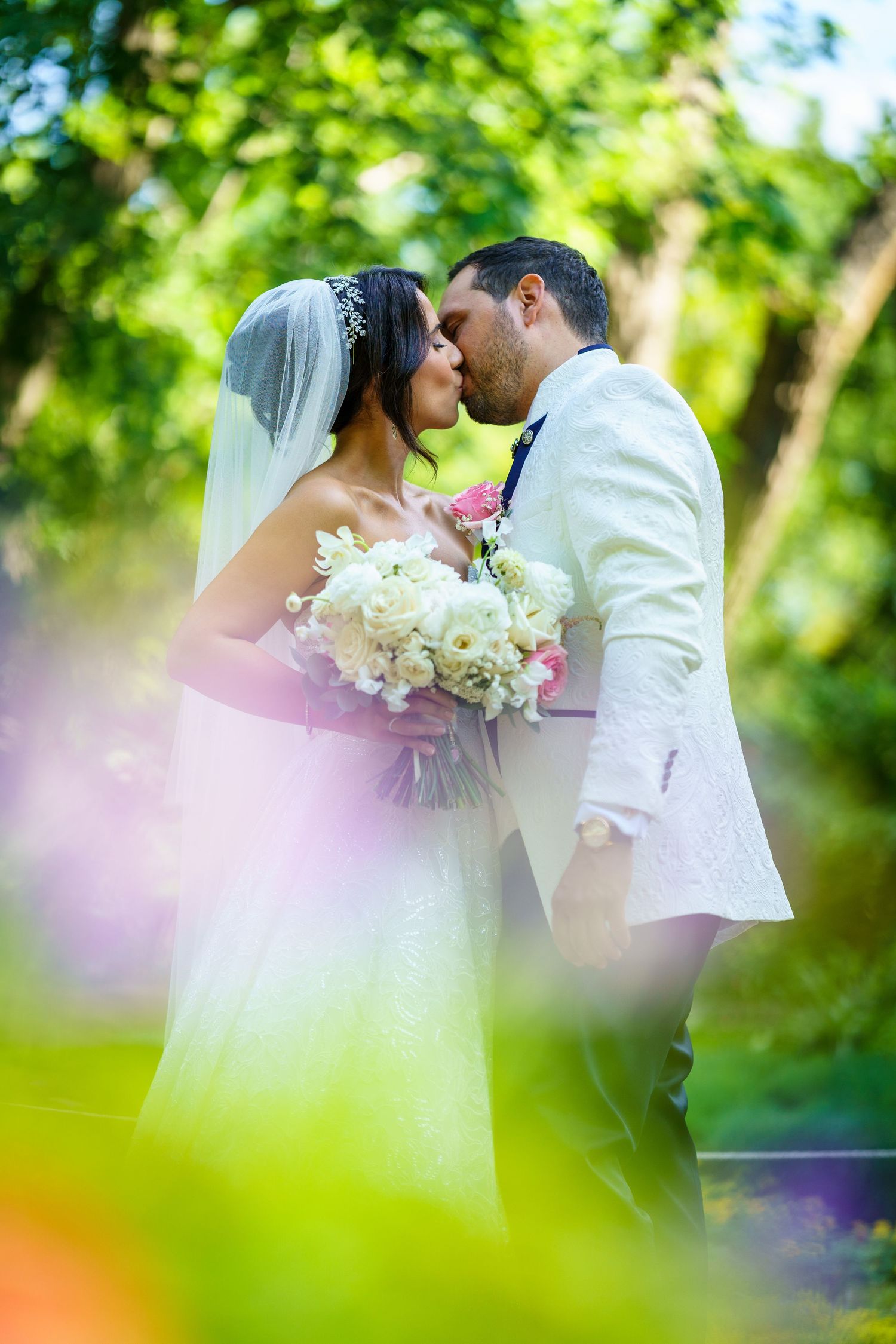 Married couple kissing in the Centre de la Nature park in Laval, Quebec