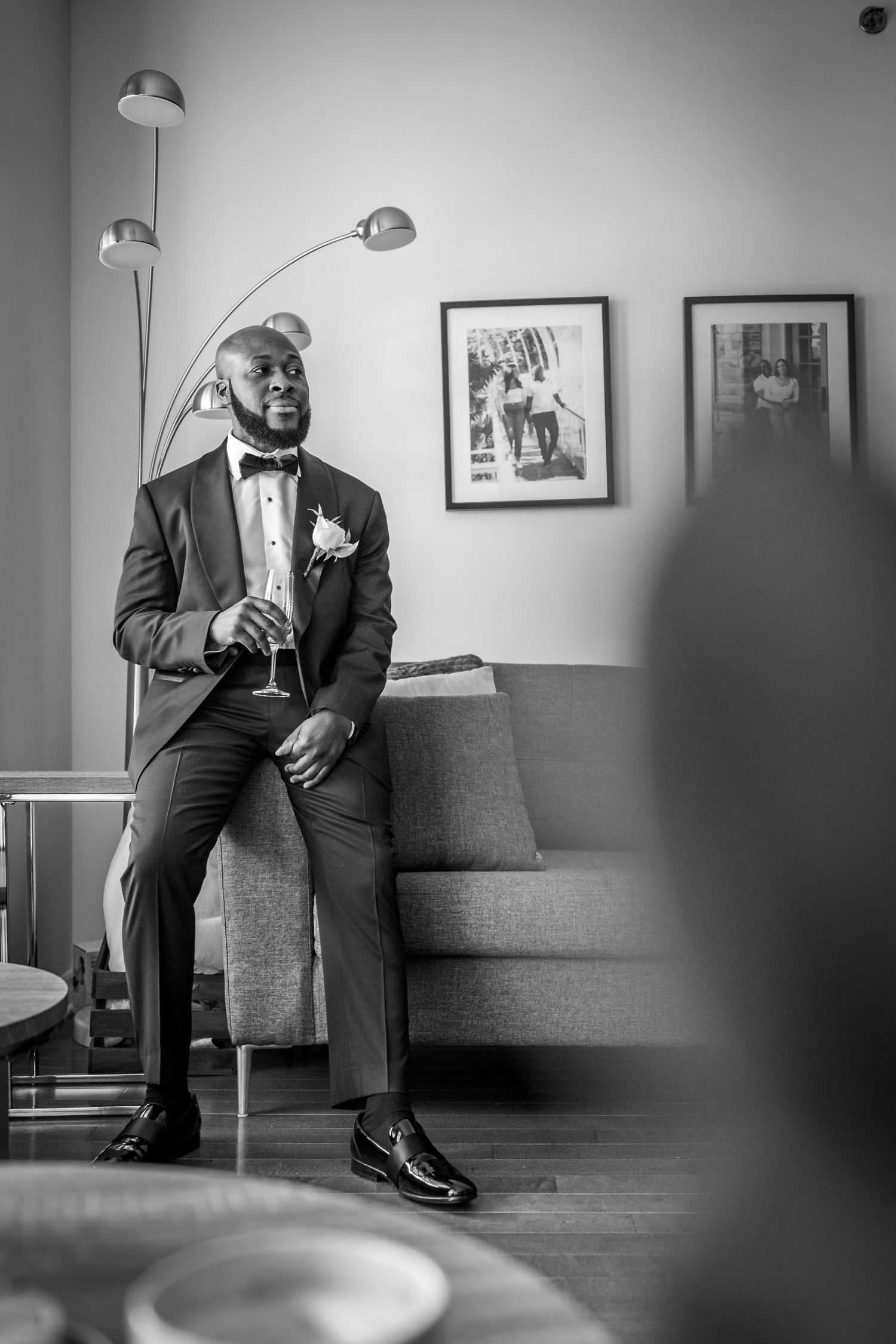 Groom having a drink while getting ready for his wedding