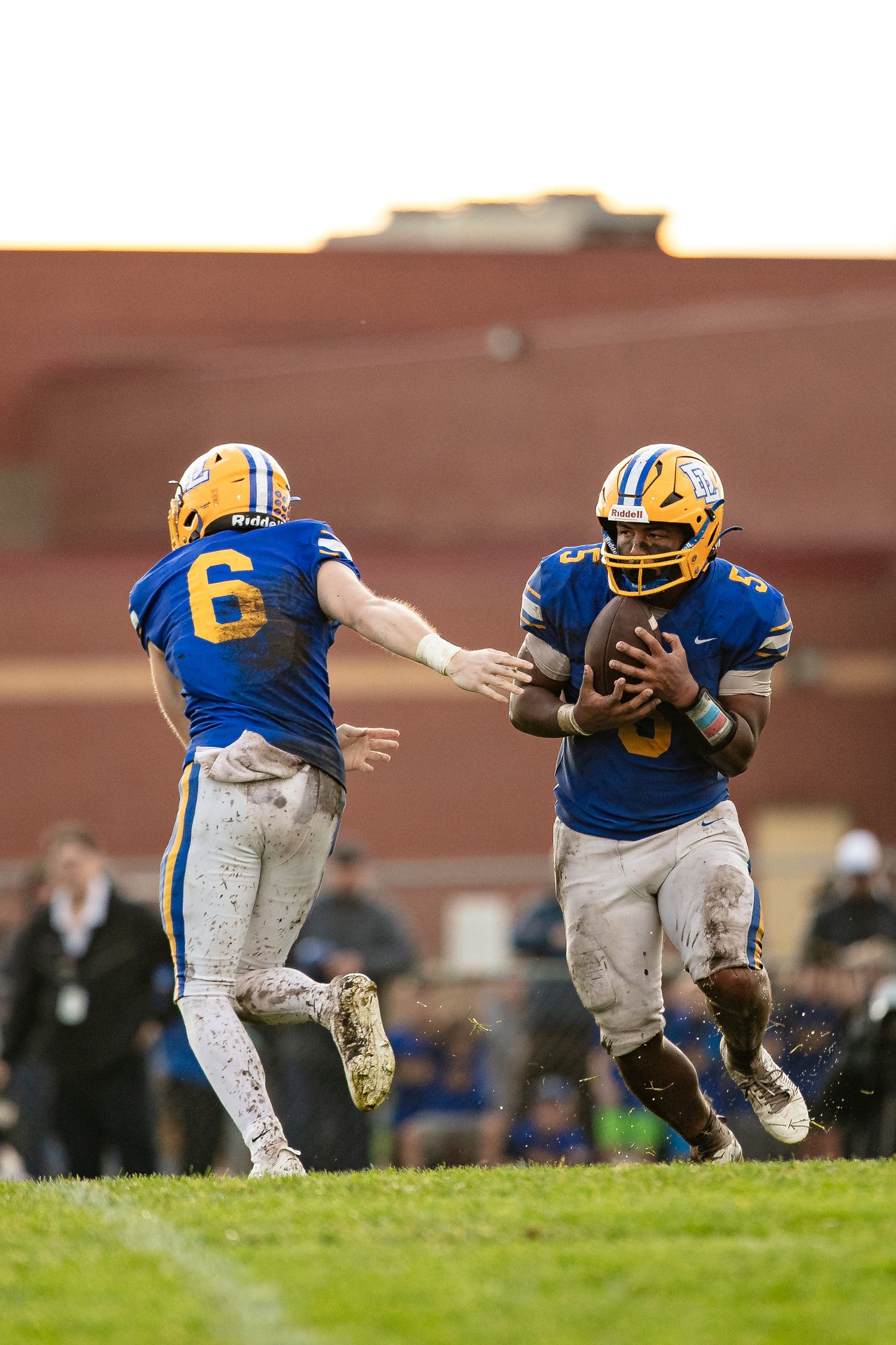 Big Lake Hornets Football handoff gameday action photos.