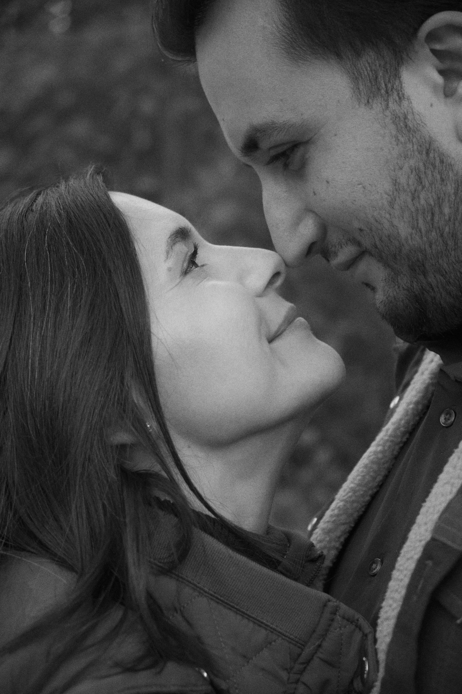 A romantic black and white photo series showing a couple about to kiss in five sequential frames.