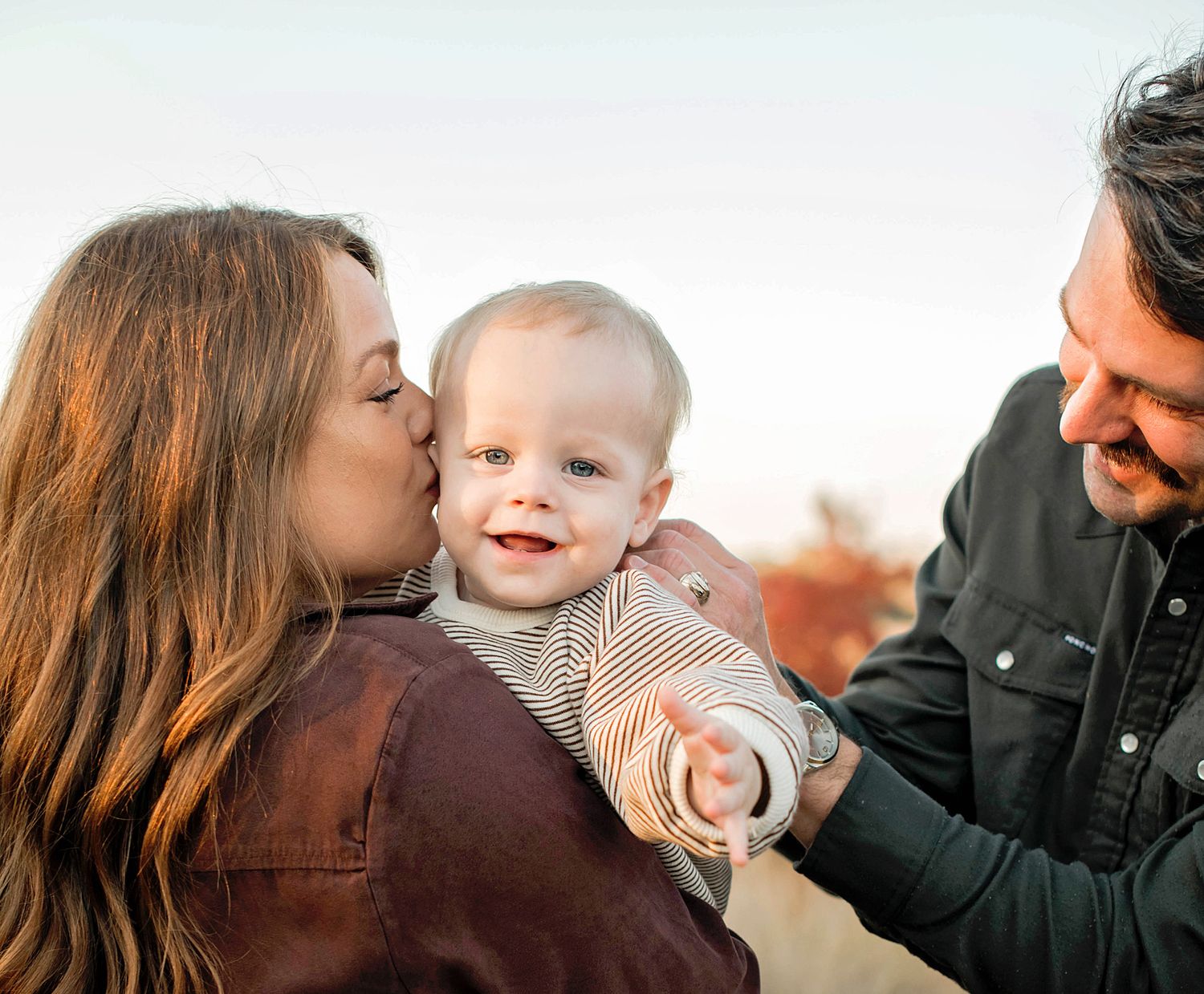 Loving family moments captured in a series of candid outdoor portraits during golden hour.