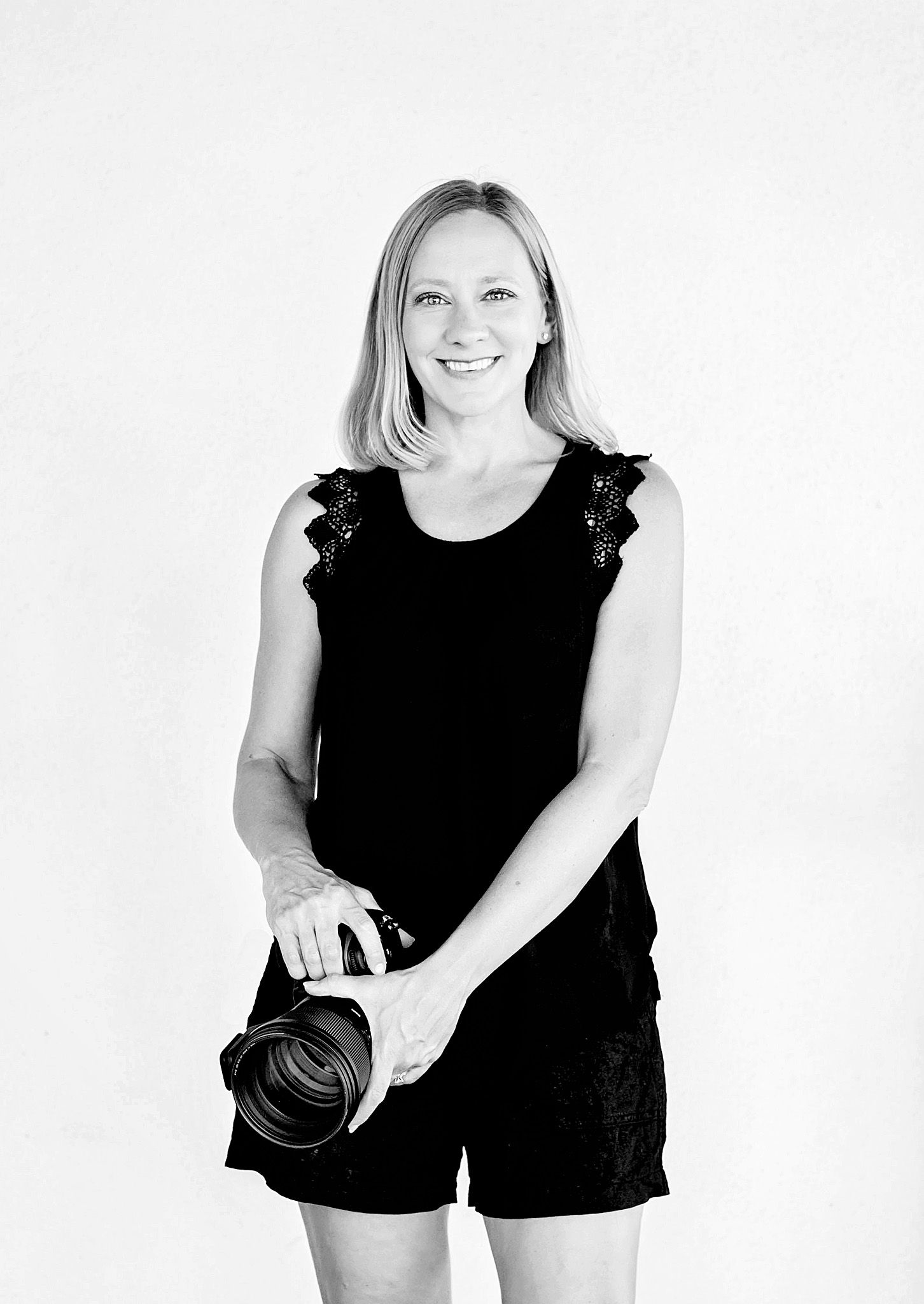 A black and white photo series showing three poses of a person in a sleeveless black outfit against a white background.