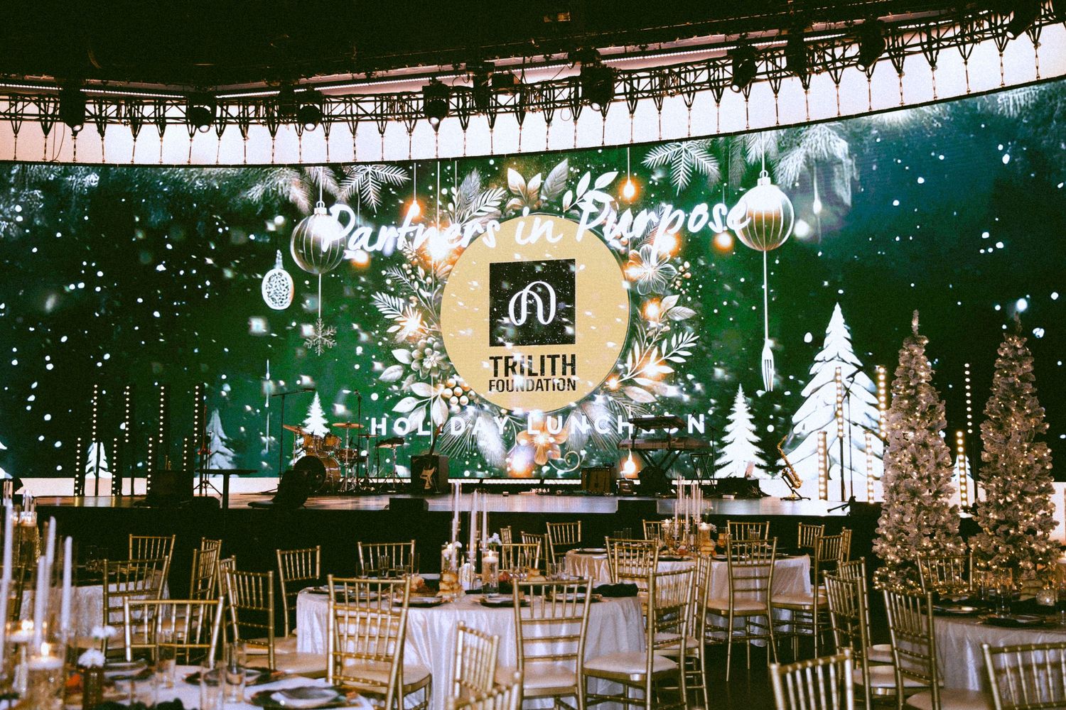 Luxurious wedding reception setup with crystal chandeliers and elegant table settings.