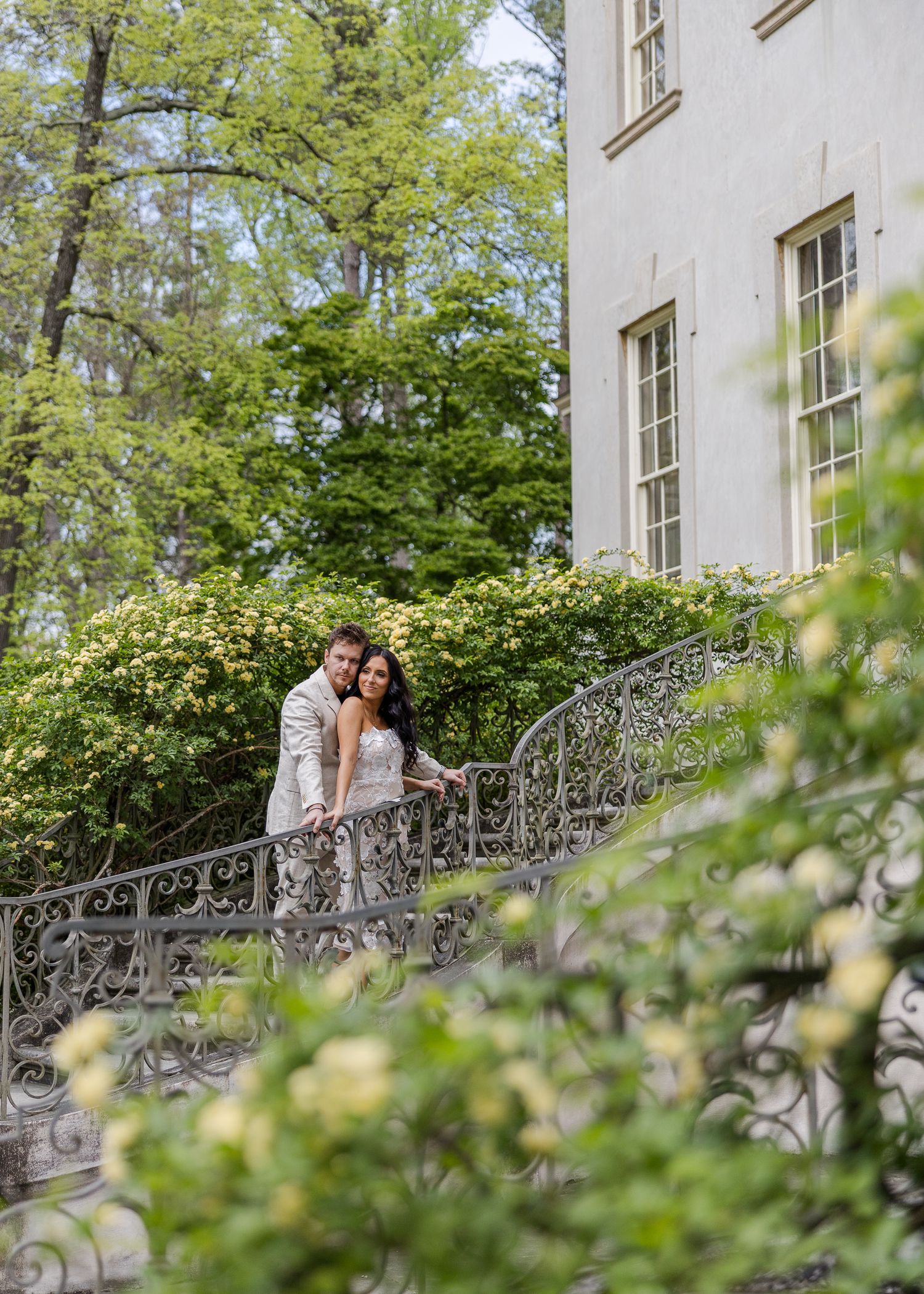 Couple embracing in front of the historic Swan House fountain and grounds at the Atlanta History Center