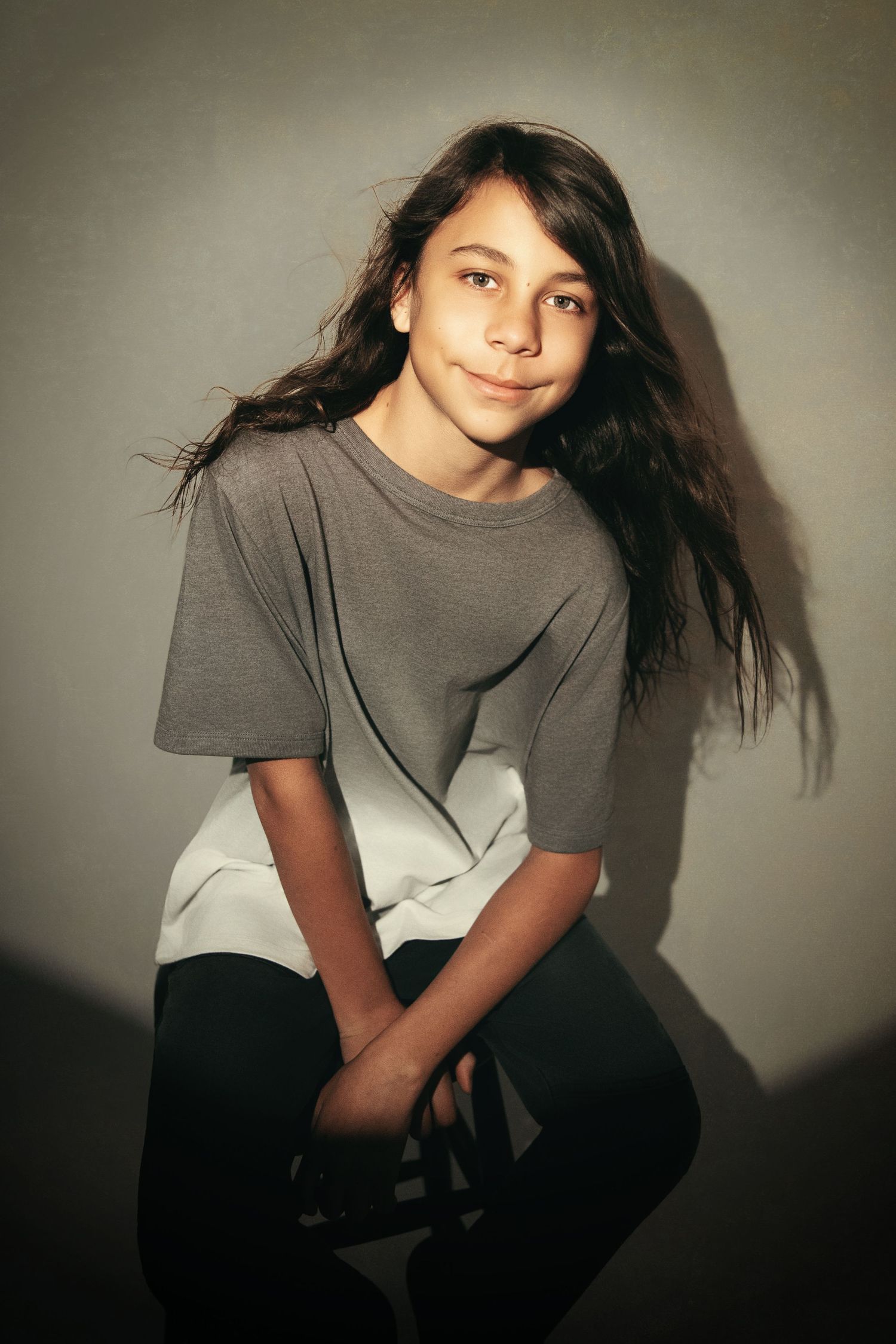 Portrait sequence showing casual poses in grey clothing against light backdrop.