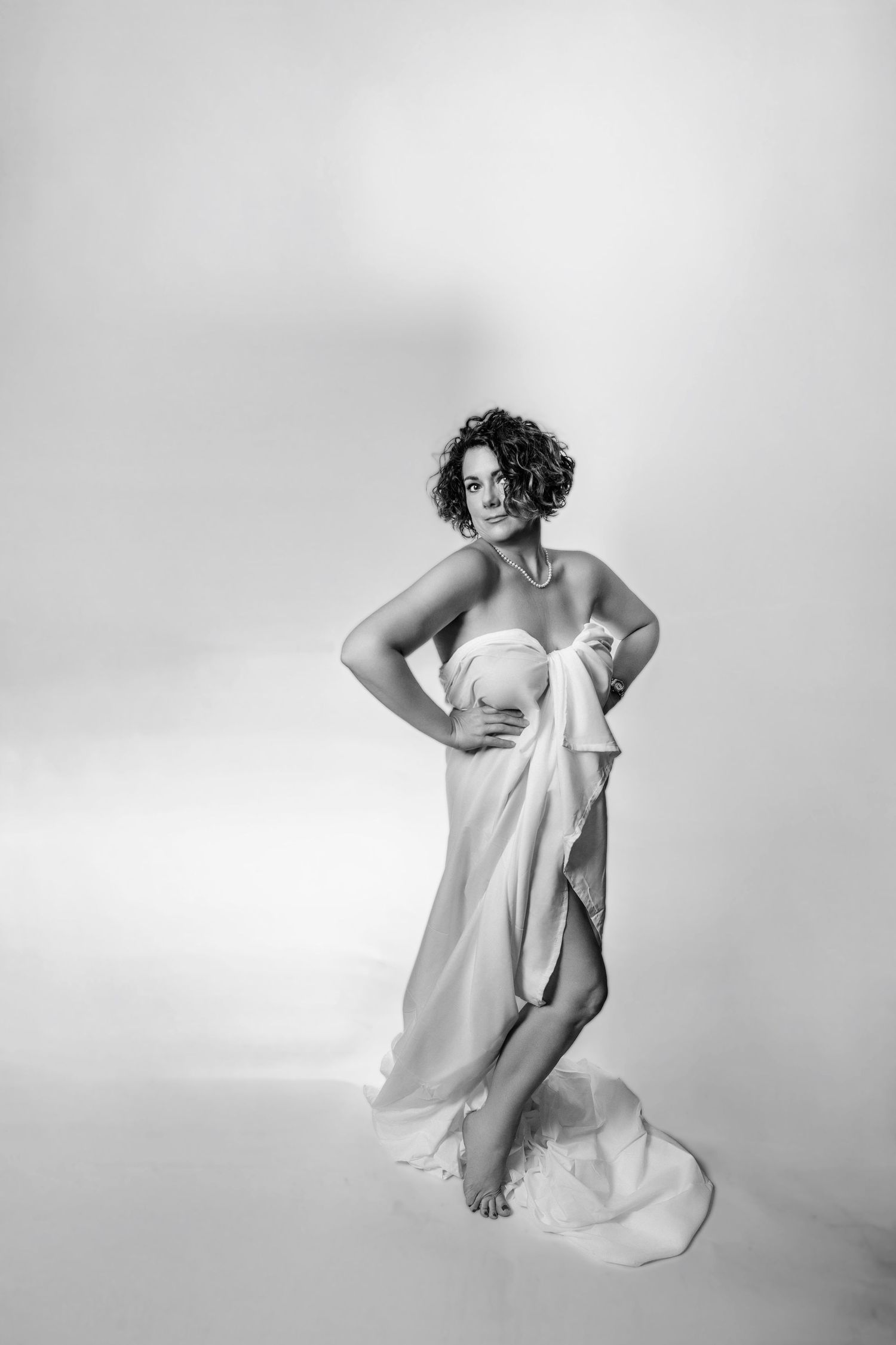 Artistic black and white photos with flowing white fabric and dynamic movement.