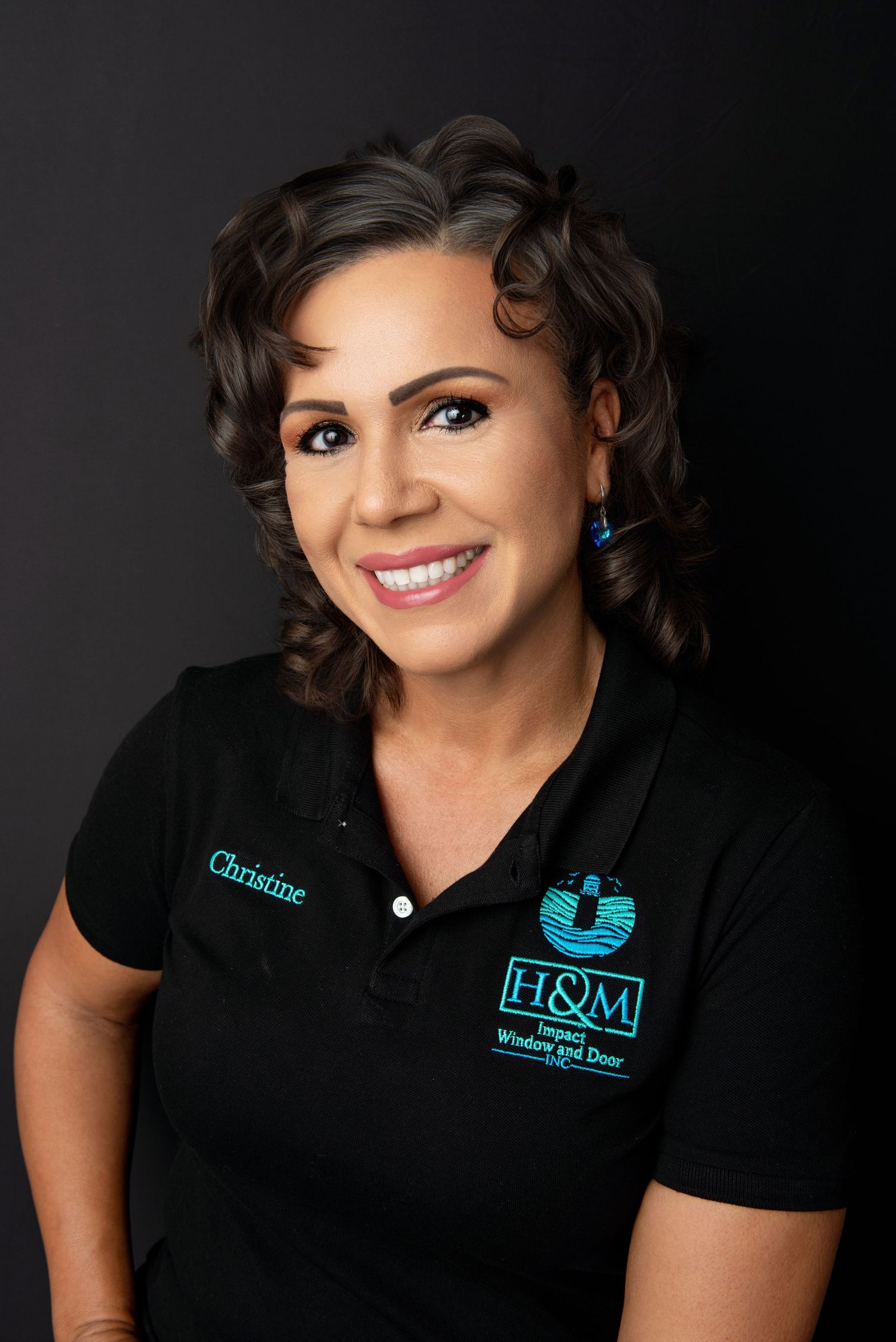Professional headshots in black polo with teal logo against dark background.