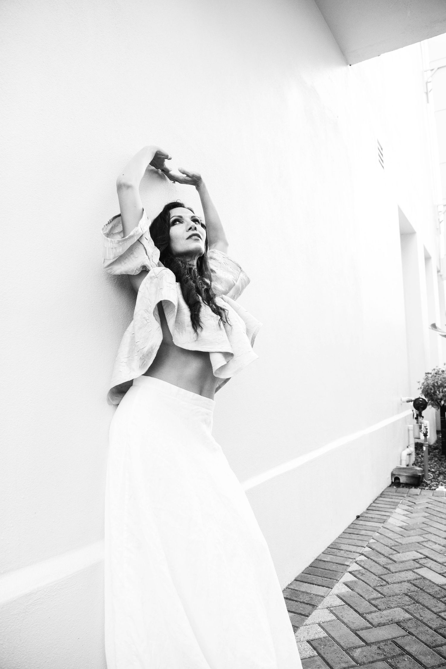 Artistic black and white portraits showing expressive poses against white background.