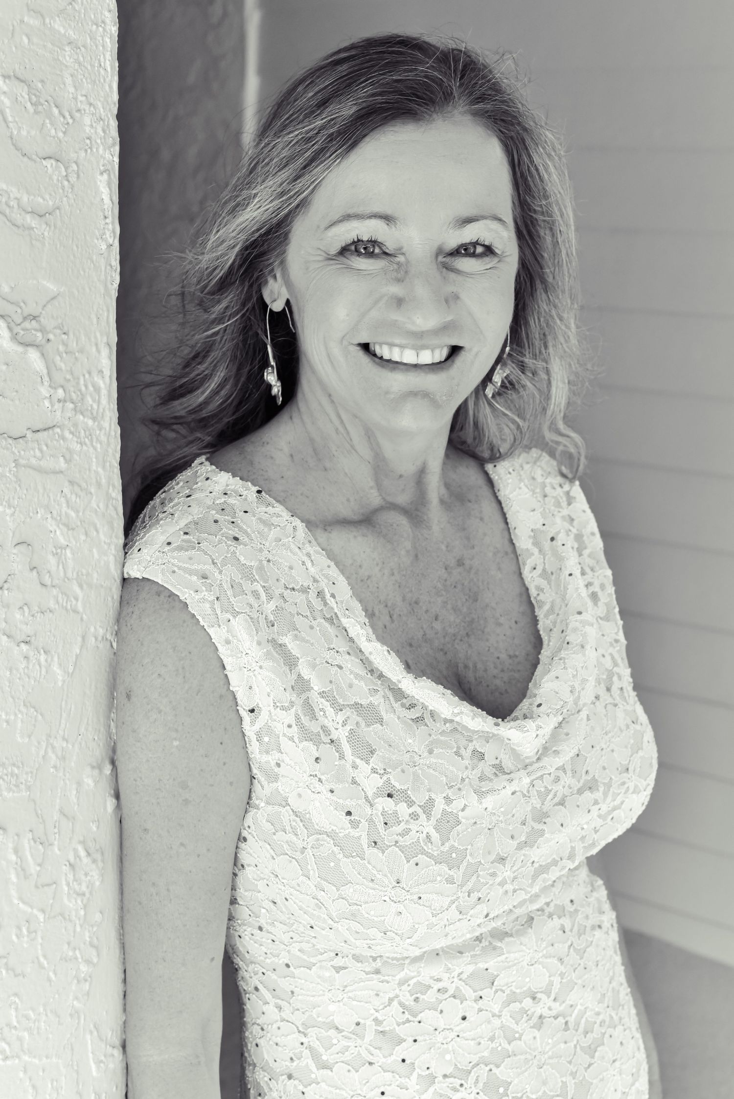Black and white portraits in lace top showing natural expressions and soft lighting.