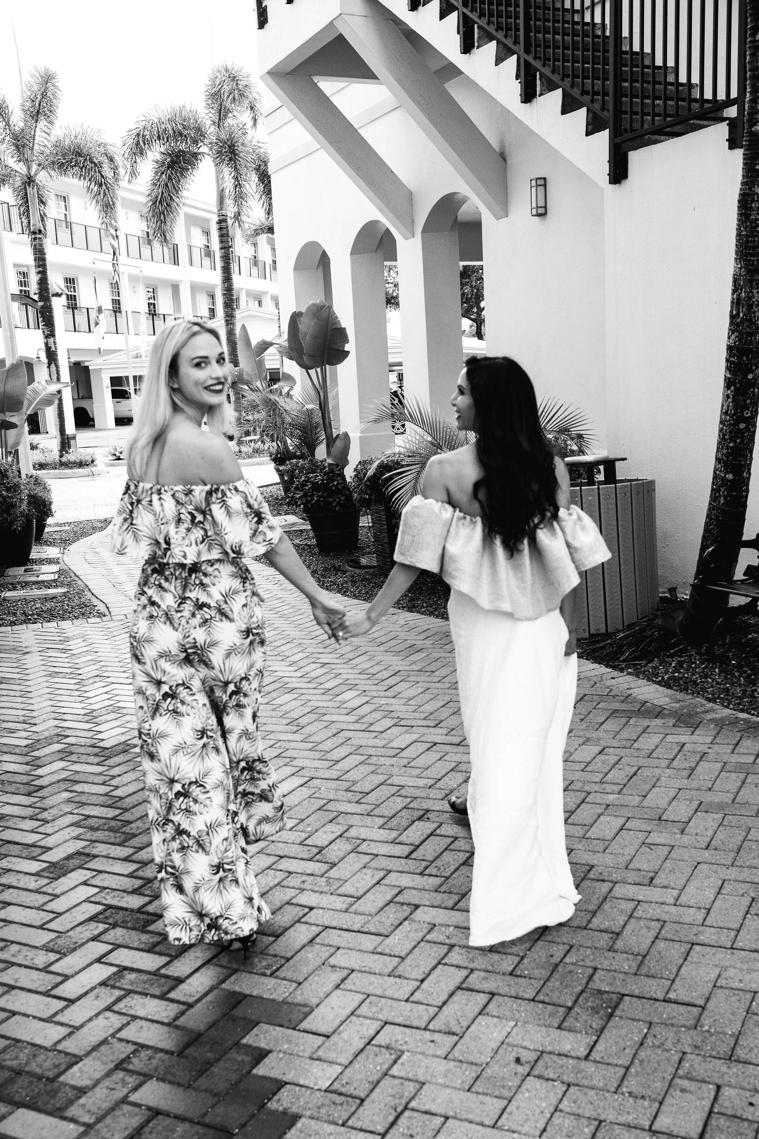Models Madison Miller and Azlina Goldstien wearing Fashion Designs from local treasure coast designer Kallee Jackson walking through Jensen