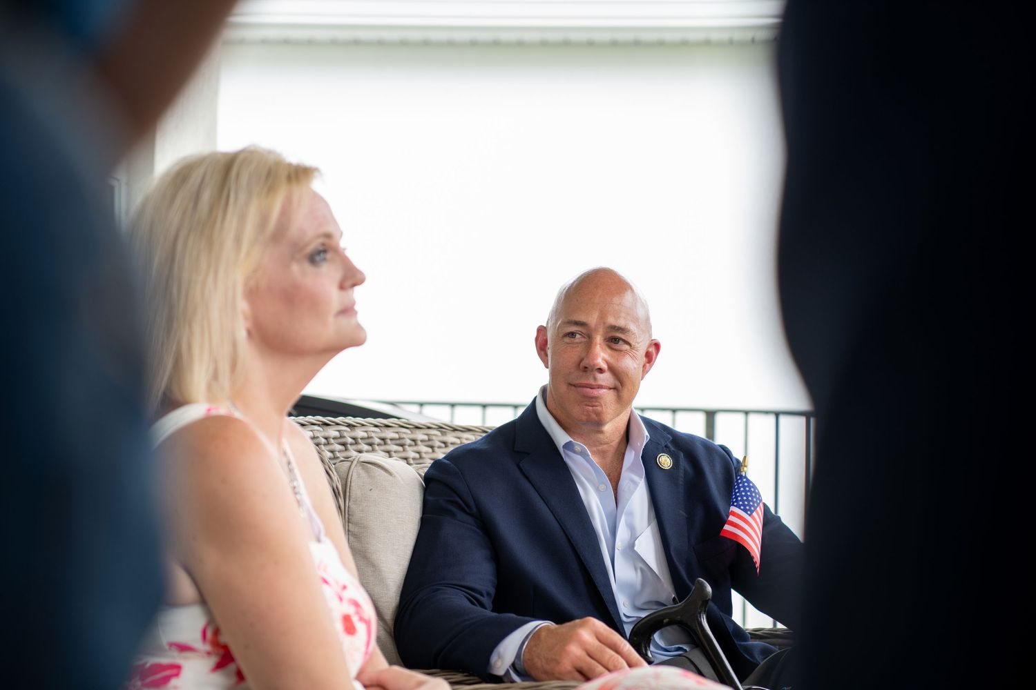 Congressman Brain Mast sits with veteran for the Wounded warriors project