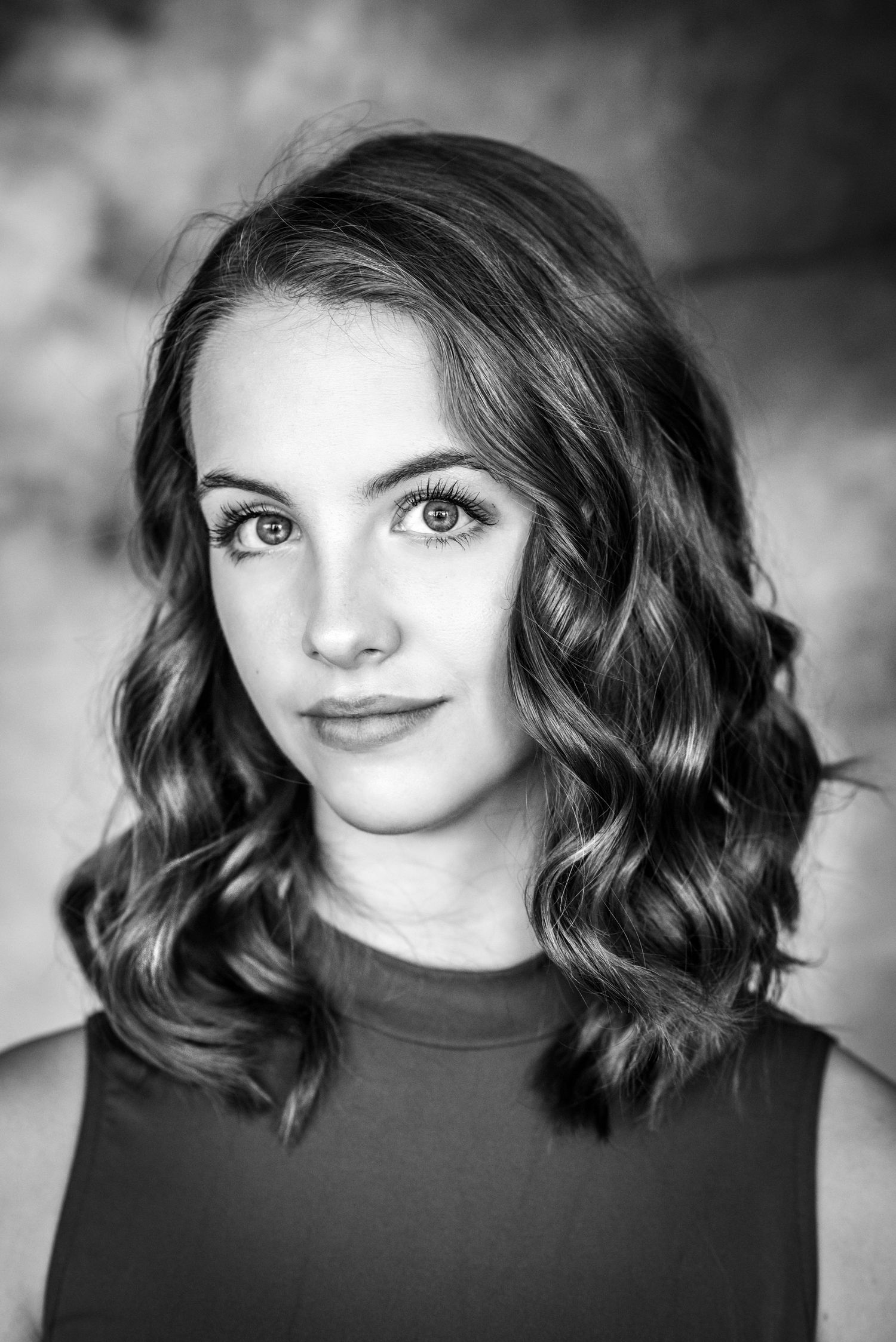 Dramatic black and white portrait series with soft lighting and natural expressions.