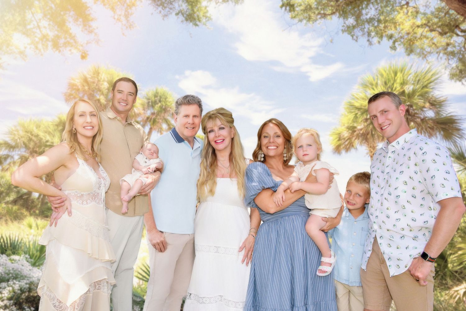 Beach family portraits with soft lighting and coordinated pastel outfits.